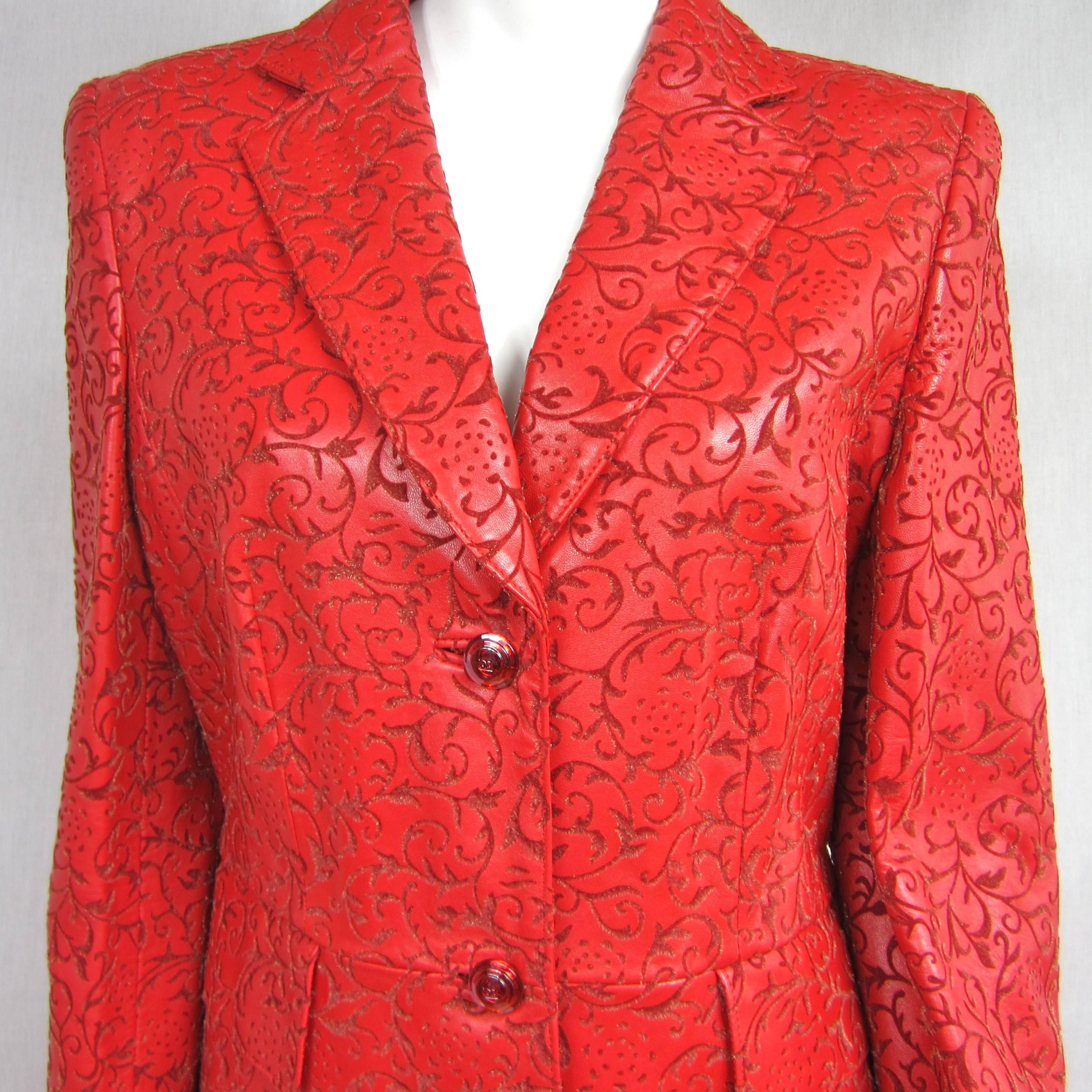 AMAZING SUIT in a more amazing COLOR Again, NEW OLD STOCK with the Price tags still attached. Take a look at the embossed motif on this set. It has s subtle shimmer to it. Stunning! Escada Red Leather Fitted Jacket and Skirt, Embossed with a floral