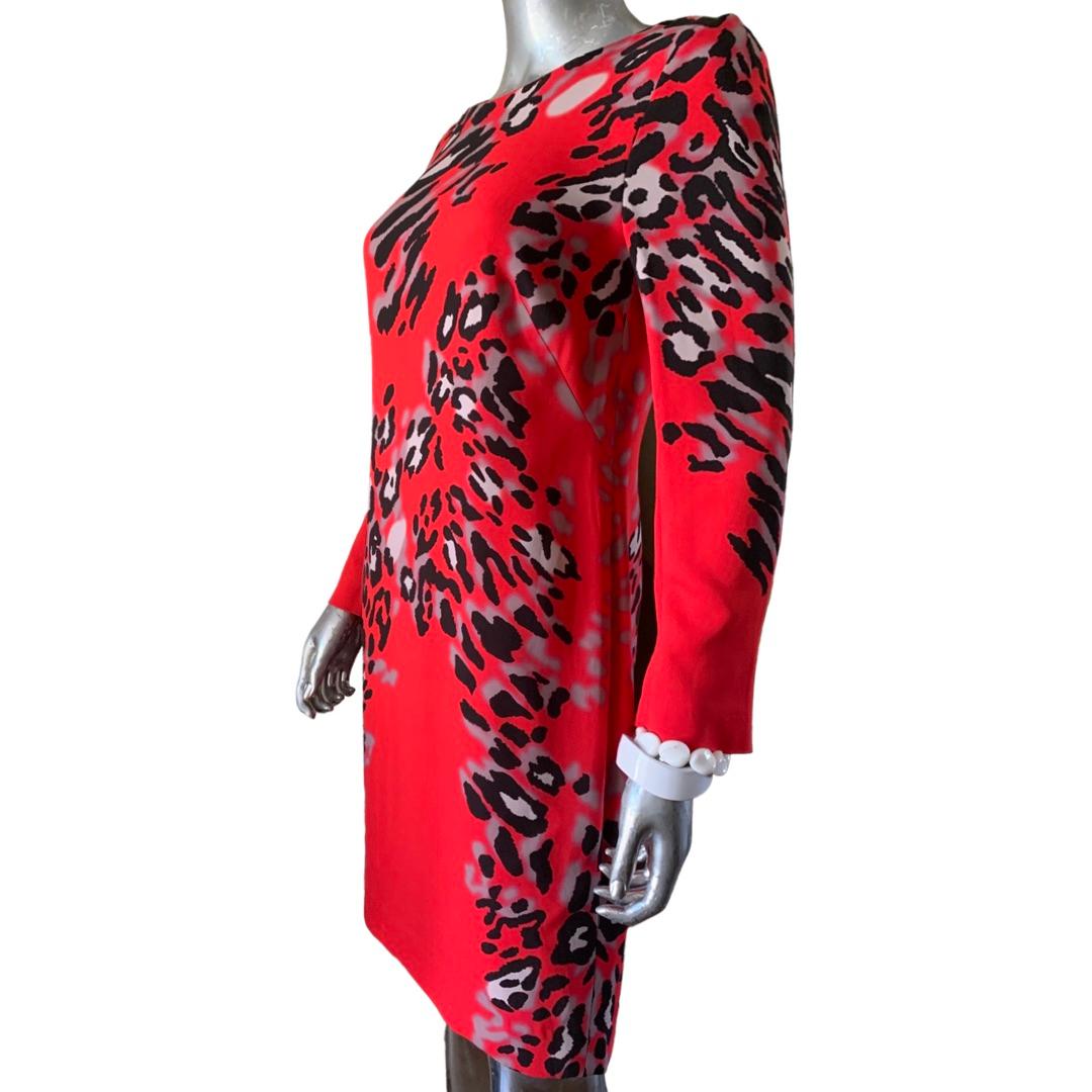 A super beautiful print from German company, Escada. black, grey and white leopard on beautiful red ground. Improrted viscose blend fabric. fully lined. Modern exposed black zipper in back of dress. Sleeve has zipper cuffs to make a slight bell