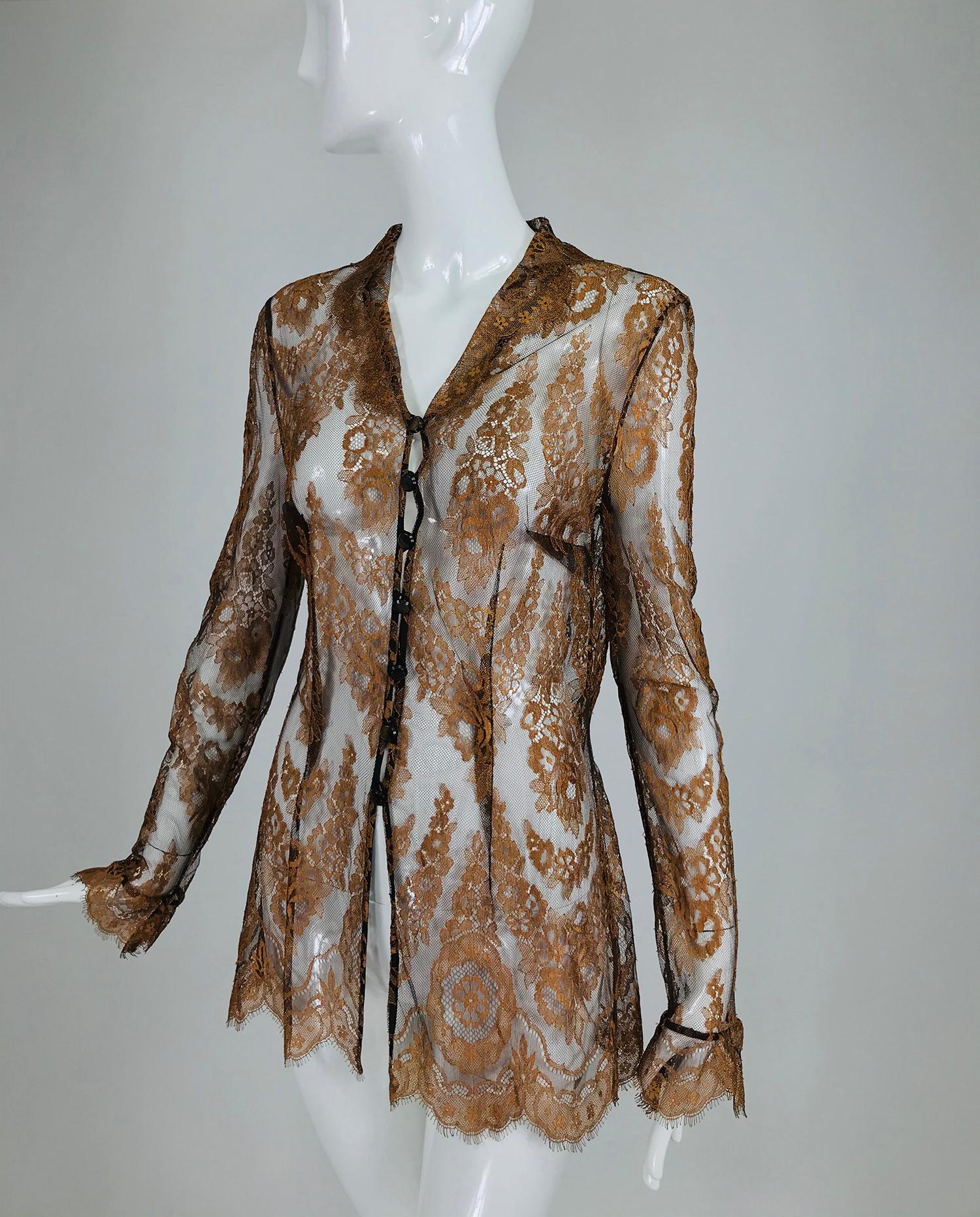 Escada russet lace long sleeve blouse. This beautiful blouse is sheer and unlined. Button front blouse, closes with loops and buttons, there is a collar, the neckline is a V. The torso is long and semi fitted. Long sleeves have ribbon band at wrist
