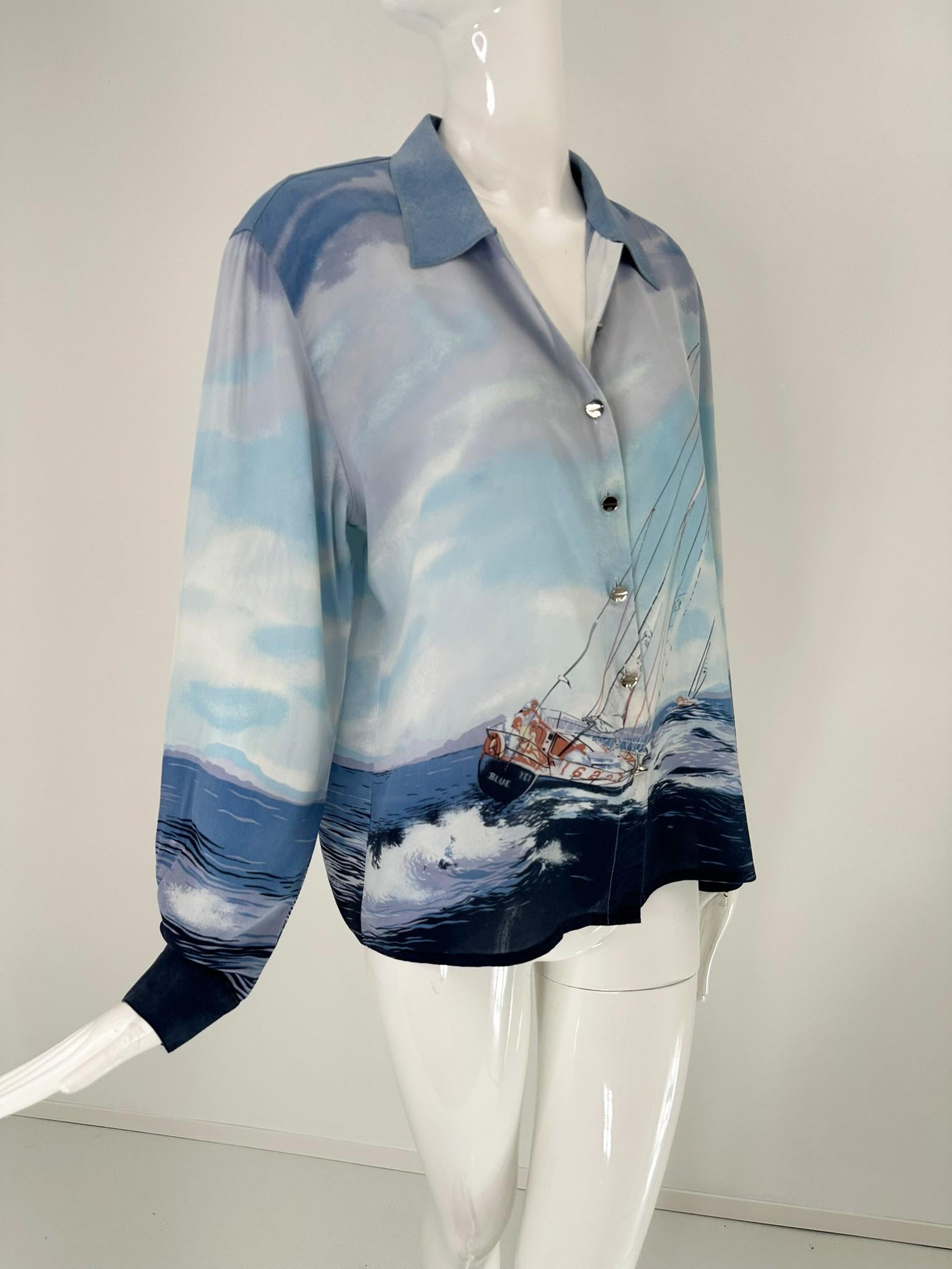 Escada sail boat silk print blouse, with long button cuff sleeves, wing collar and straight hem. From the 1980s, with silver logo buttons. Marked size 42. 
In excellent wearable condition.  All our clothing is dry cleaned and inspected for condition