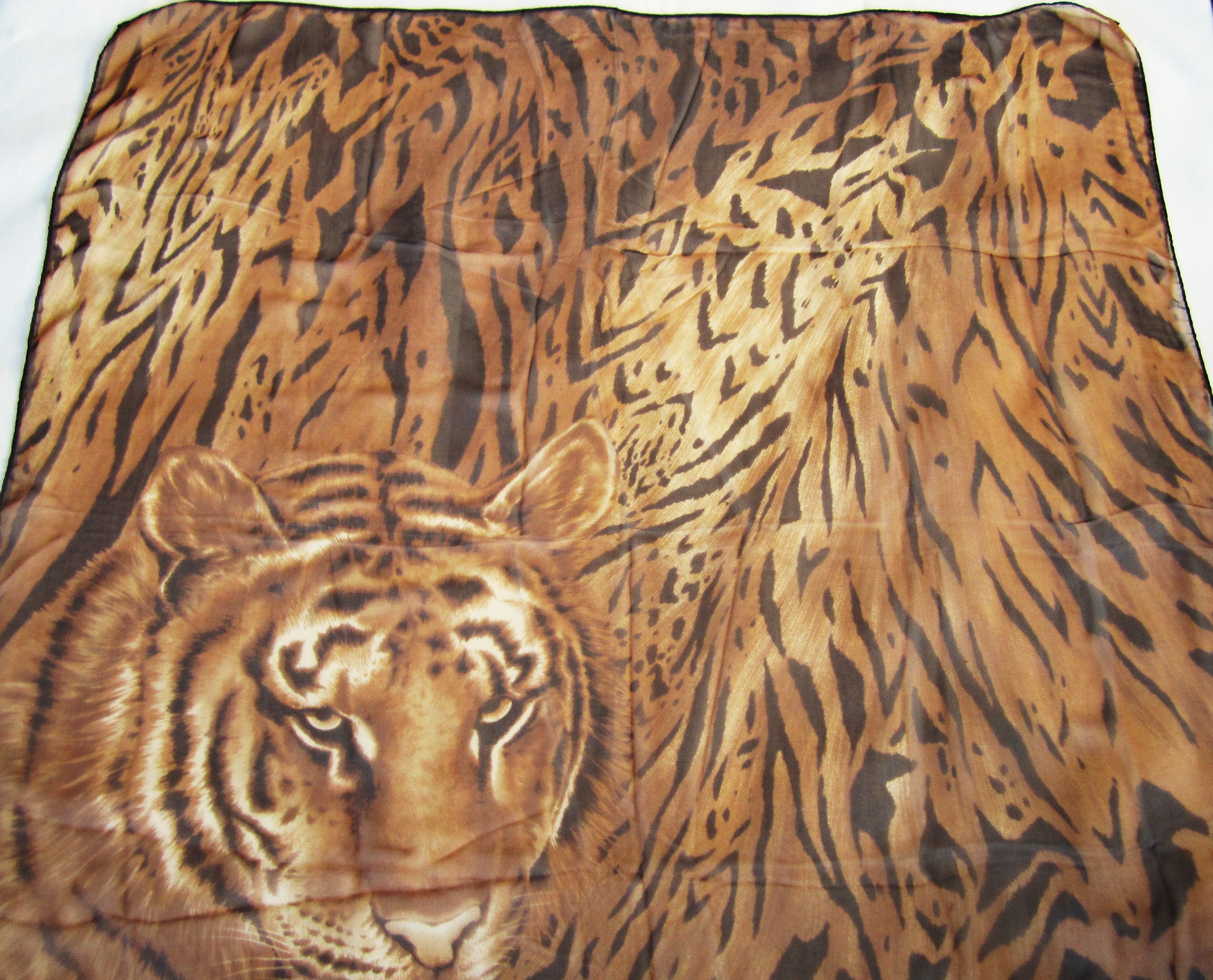 This is from a Vast Collection of Scarves that have never been worn. Wonderful Tiger Face and motif make up this Silk Escada Scarf.  Purchased in the late 1980s early 1990s stored away, new old stock  Made in Italy Hand Rolled Silk. This is out of a