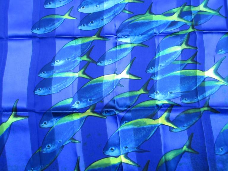 This is from a Vast Collection of Scarves that have never been worn. Featuring an underwater scene of fish. Vibrant Electric Blue and Green. Made in Italy. Hand Rolled Silk. 34 in. x 34 in. This is out of a massive collection of Contemporary