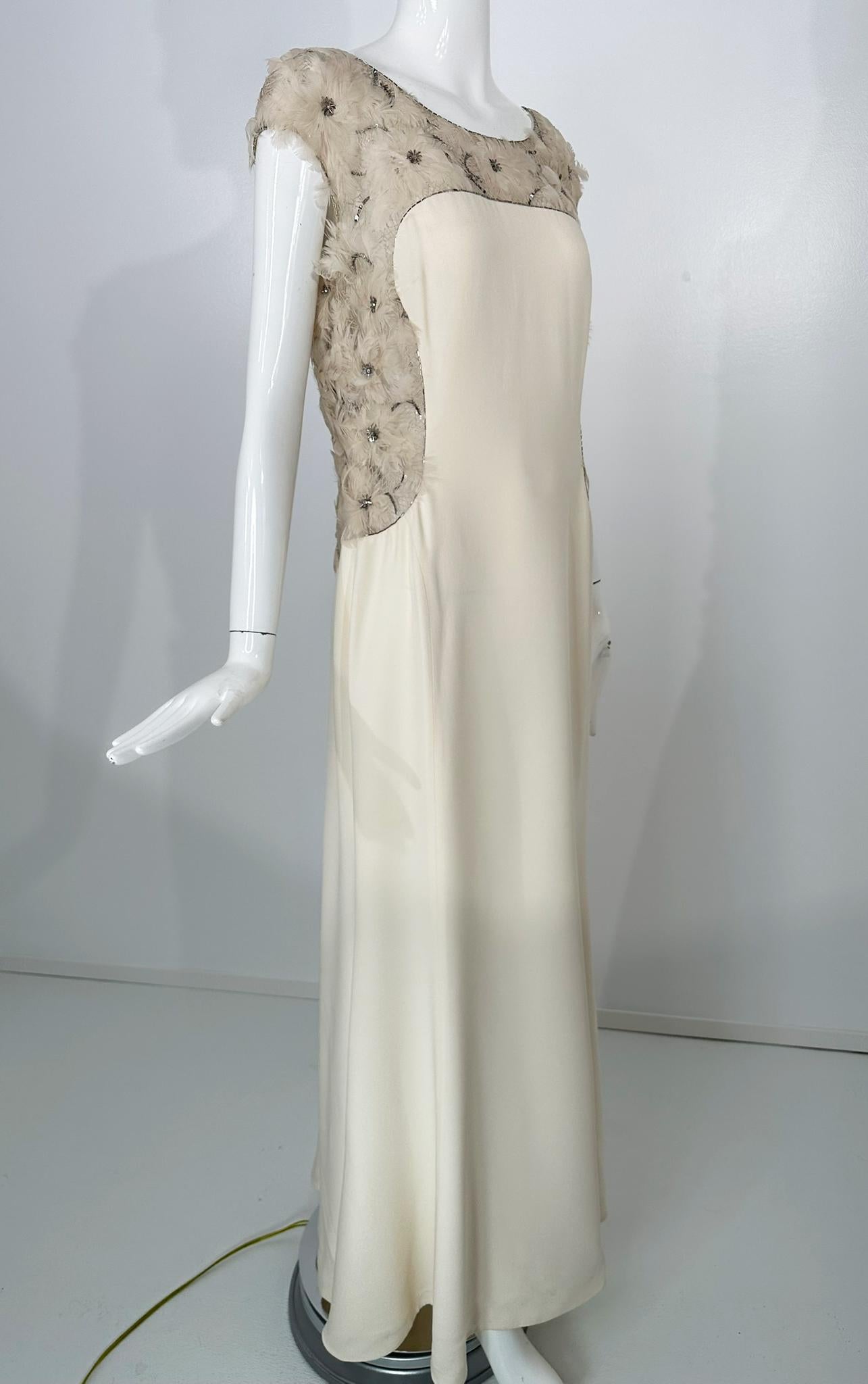 Escada rare silver sequins, silver tube beads,  crystal rhinestones & feather rosettes, cream silk gown.  Scoop neck, princess seam gown with cap sleeves, yoke front, sides & back are covered in feather rosettes each with silver sequin & crystal