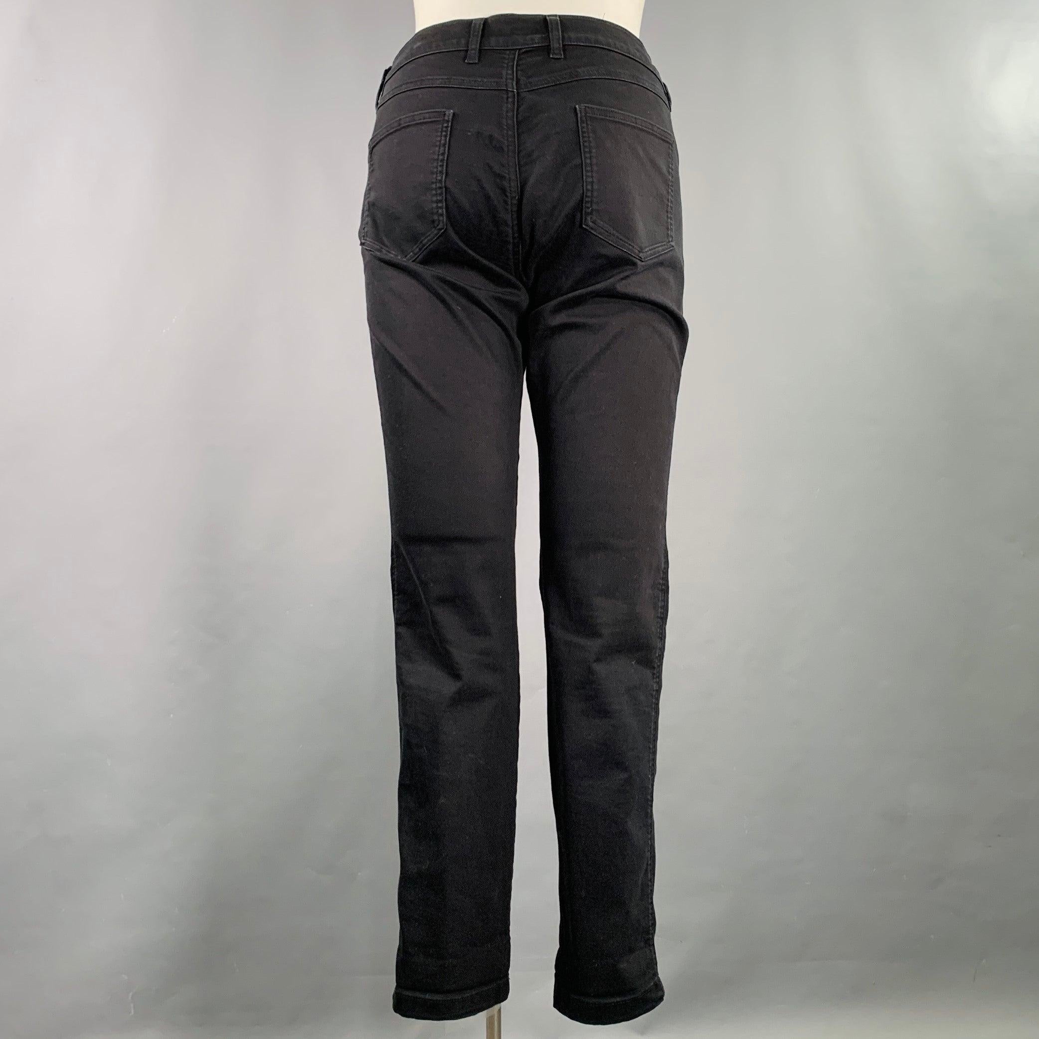 ESCADA jeans
in a black cotton blend denim featuring a five pockets style, straight leg, and zip fly closure. Excellent Pre-Owned Condition. 

Marked:   IT 42 

Measurements: 
  Waist: 37 inches Rise: 8.5 inches Inseam: 31 inches 
  
  
 
Sui