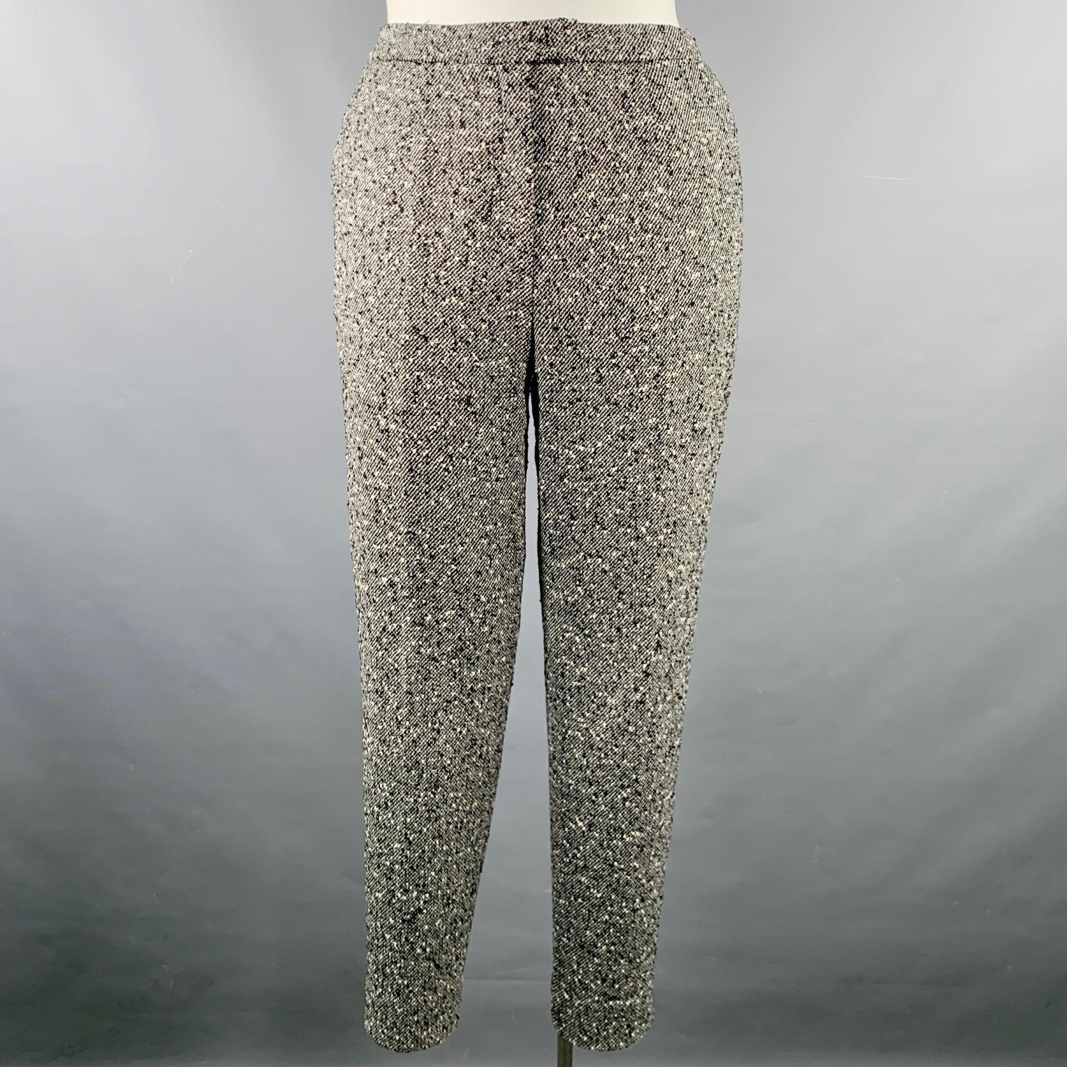 ESCADA dress pants
in a black and white wool blend tweed featuring a flat front style, straight leg, and zip fly closure. Made in Croatia.Excellent Pre-Owned Condition. 

Marked:   40 

Measurements: 
  Waist: 32 inches Rise: 10 inches Inseam: 27
