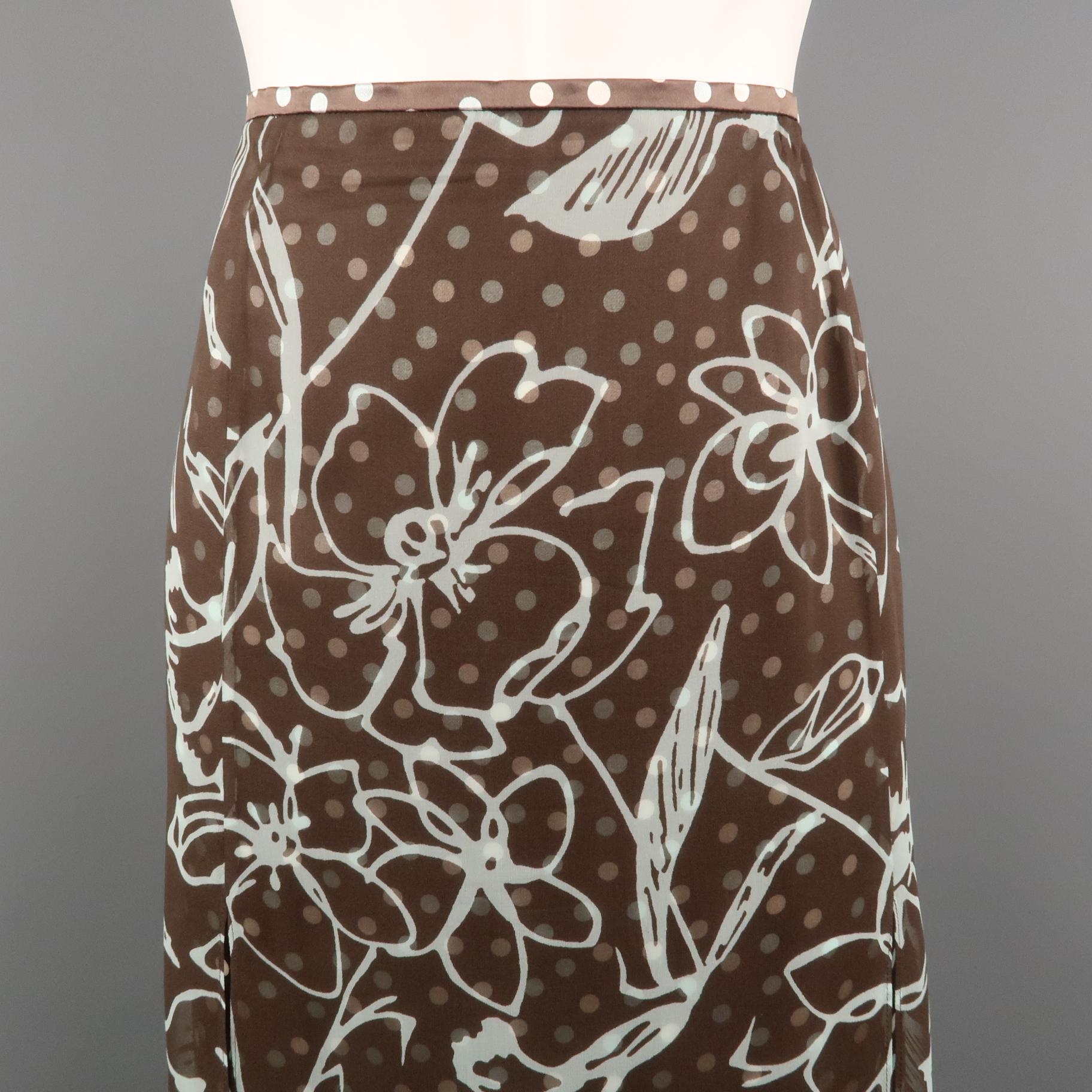 ESCADA skirt comes in brown and teal polka dot print silk with a floral print chiffon overlay, satin waistband, and dual slits. Made in Germany.
 
Excellent Pre-Owned Condition.
Marked: IT 46
 
Measurements:
 
Waist: 36 in.
Hip: 46 in.
Length: 27 in.