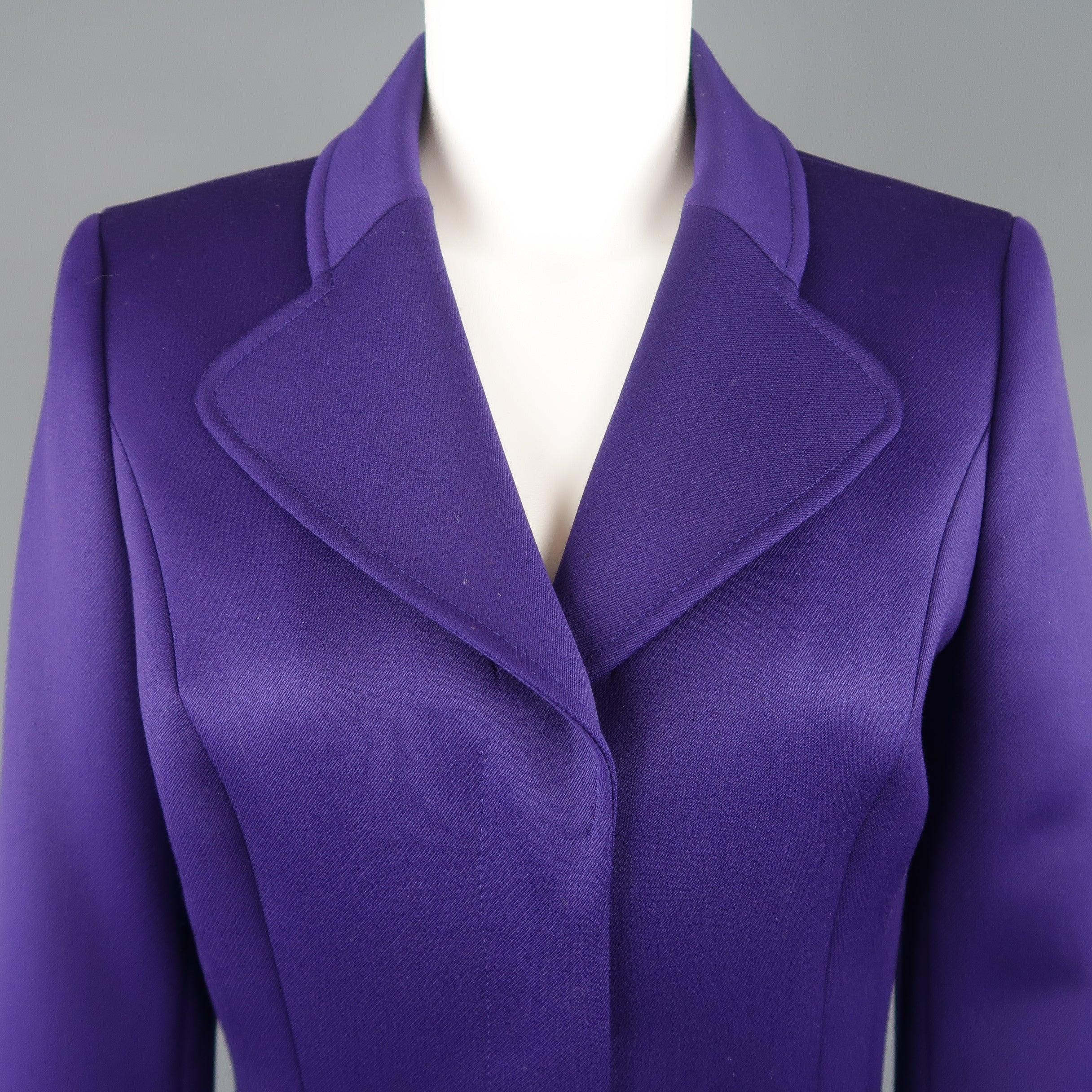 ESCADA cropped sport jacket comes in purple wool blend twill with a pointed lapel, hidden snap closures, and belted waist. 
 Excellent Pre-Owned Condition.
  
 

 Marked:  DE 34
  
 

 Measurements: 
  
 l Shoulder: 15 inches 
 l Bust: 38 inches 
 l