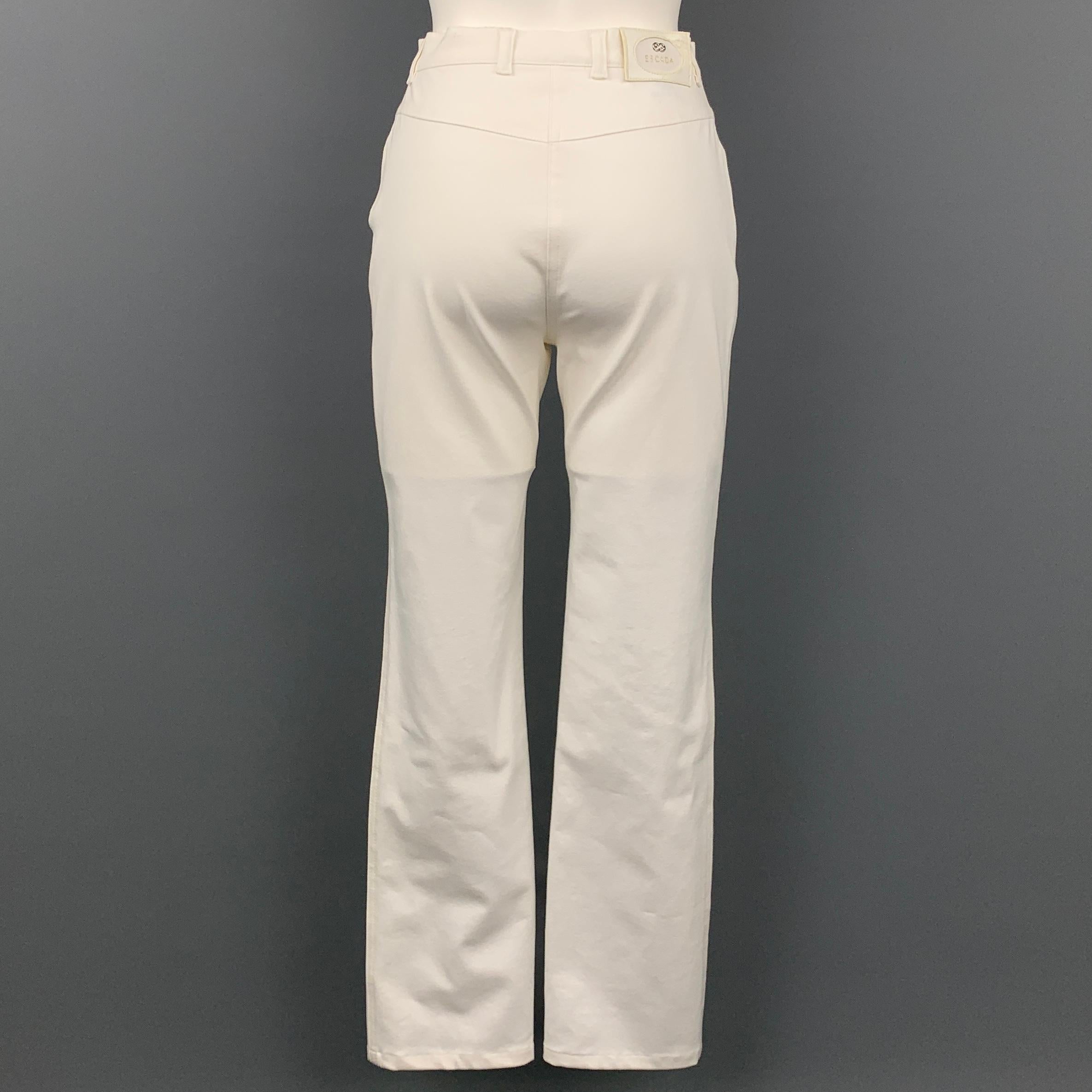 ESCADA dress pants comes in a white stretch cotton featuring a straight leg, gold tone hardware, and a zip fly closure.

Very Good Pre-Owned Condition.
Marked: 34

Measurements:

Waist: 26 in.
Rise: 10 in.
Inseam: 30 in.  