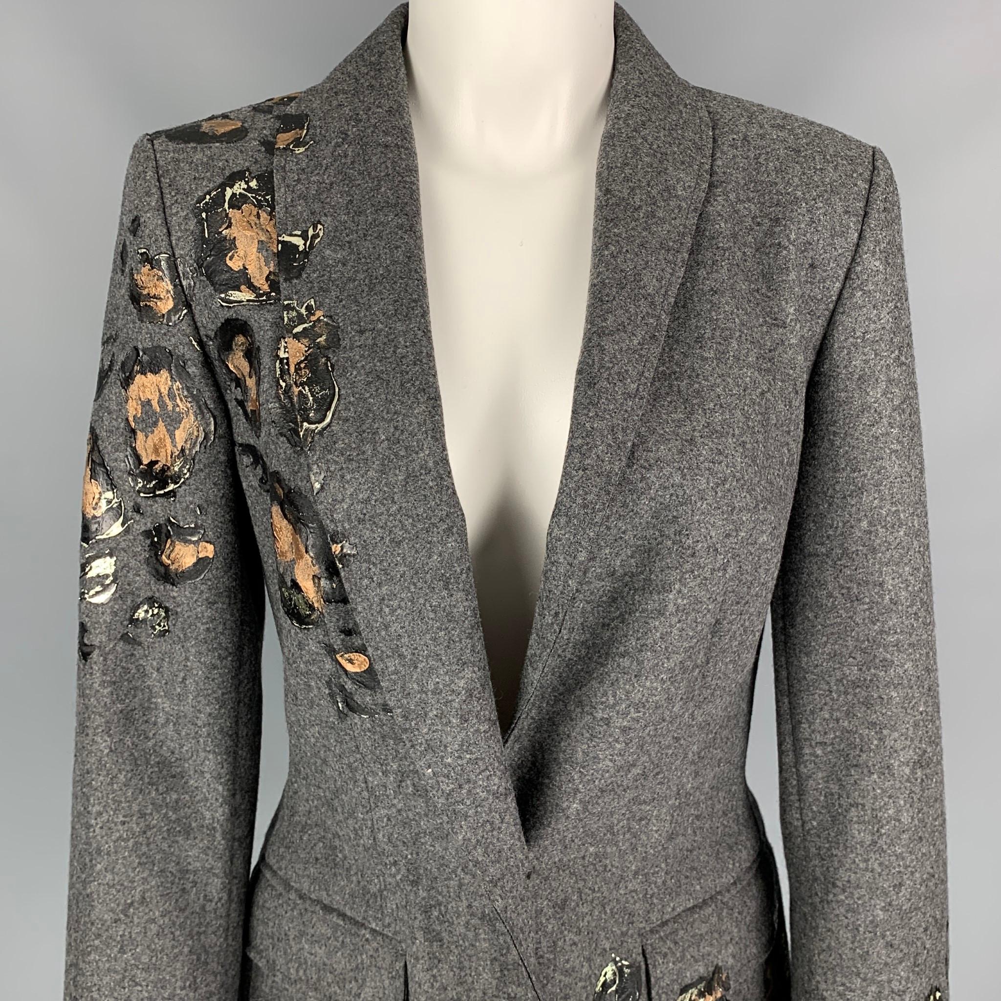ESCADA jacket comes in a grey virgin wool featuring a shawl collar, paint splattered details, flap pocket, and a single button closure. 

New With Tags. 
Marked: 36
Original Retail Price: $2,195.00

Measurements:

Shoulder: 16 in.
Bust: 36