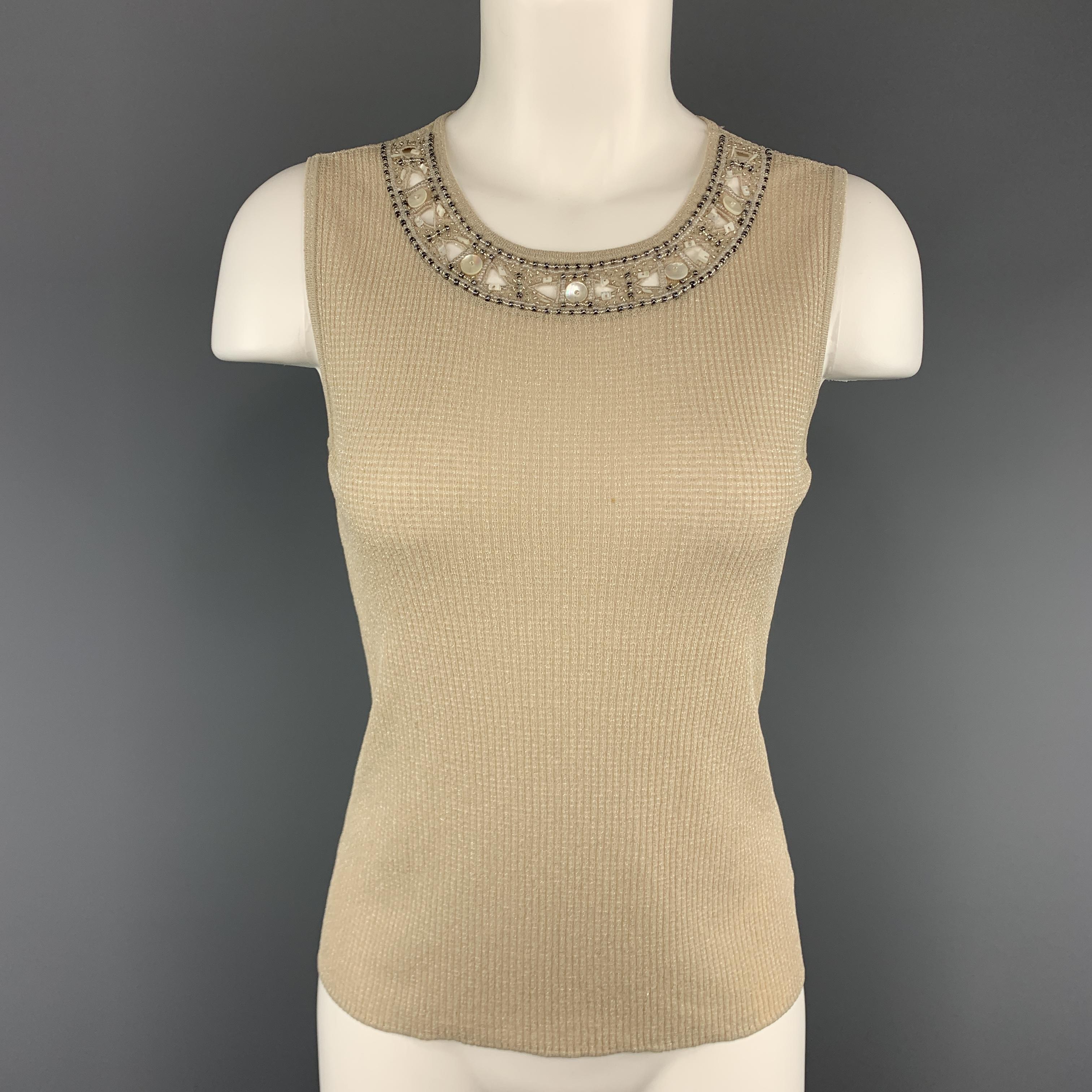 ESCADA twin set comes in beige sparkle ribbed knit and includes a V neck cardigan with beaded neckline and matching sleeveless top.
 
Very Good Pre-Owned Condition.
Marked: DE 38
 
Measurements:
 
Cardigan:
Shoulder: 16 in.
Bust: 38 in.
Sleeve: 25