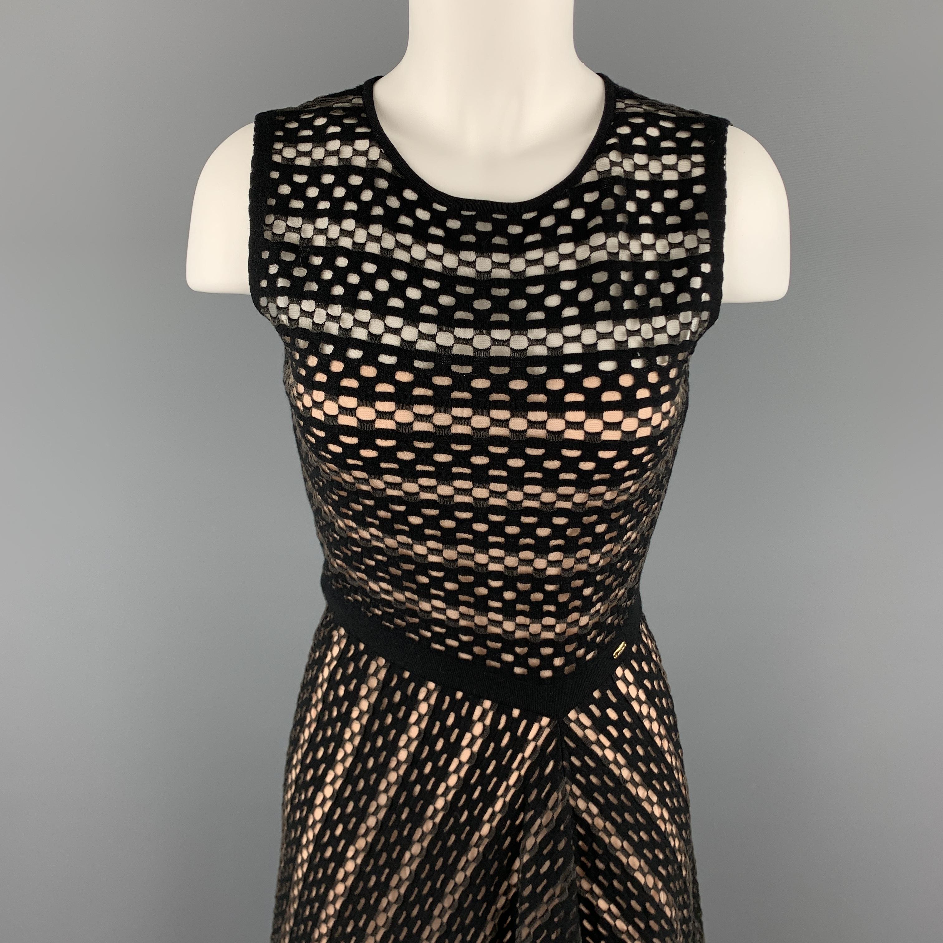 ESCADA sleeveless dress comes in black and grey stretch mesh with a round neckline, and flared skirt. Made in Italy.

Excellent Pre-Owned Condition.
Marked: S

Measurements:

Shoulder: 14 in.
Bust: 34 n.
Waist: 26 in.
Hip: 42 in.
Length: 44 in.