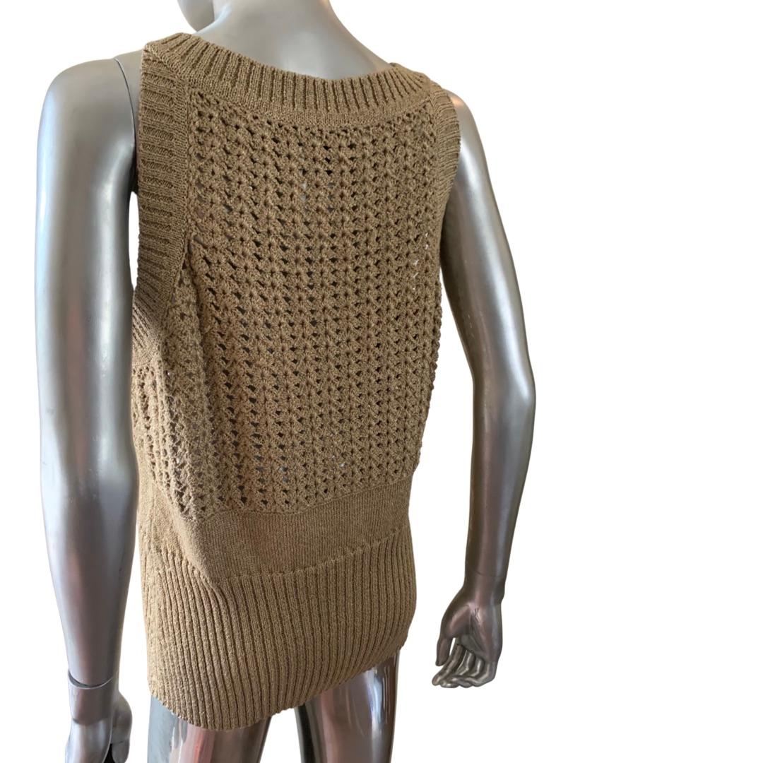 A great sweater knit by German company Escada. This was part of a collection all done in a matte gold sweater knit. This sleeveless top has a coordinating sweater coat/dress available on separate listing. This knit is very luxe looking and would