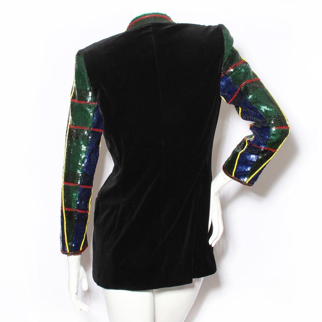 Velvet and sequin jacket by Escada Couture 
Circa 1990s
Black velvet
Tartan sequin pattern
Long sleeve
Notched collar 
Button front closure with Crown design
Three front pockets
Condition: Excellent, new with tags still attached. (see photo)