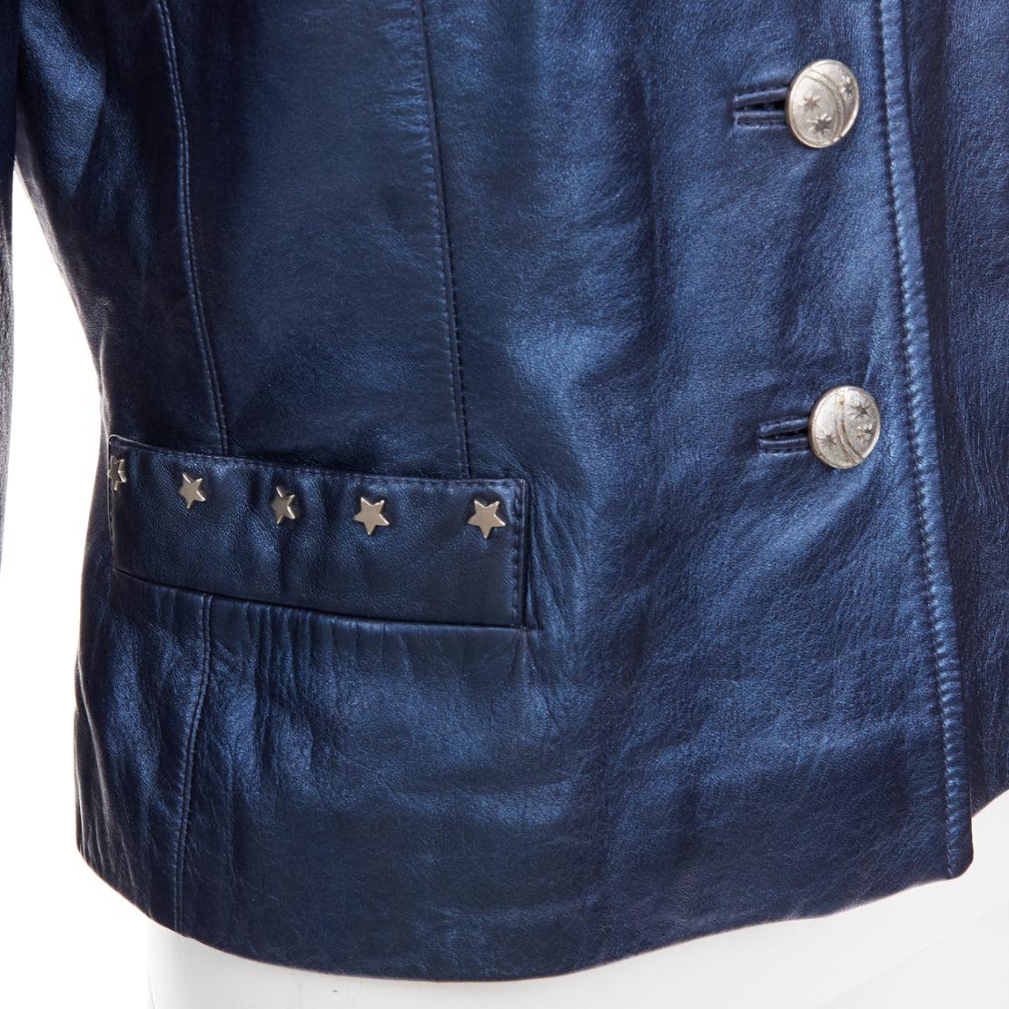 ESCADA Vintage 1980s Starry Night metallic blue leather stud jacket FR34 S
Reference: CC/A00506
Brand: Escada
Model: T LAU 500
Material: Leather
Color: Blue, Silver
Pattern: Star
Closure: Button
Lining: Blue Fabric
Extra Details: 1980s Escada