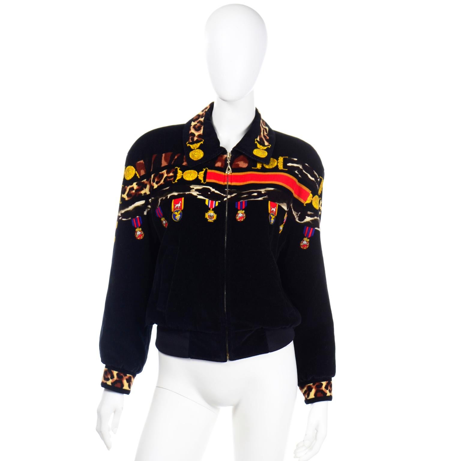 This is a really fun vintage 1980's Escada by Margaretha Ley black velvet zip front jacket with a colorful novelty medals print. The jacket has leopard print on the cuffs cuffs and in the upper bodice design. Some of the medals feature images of