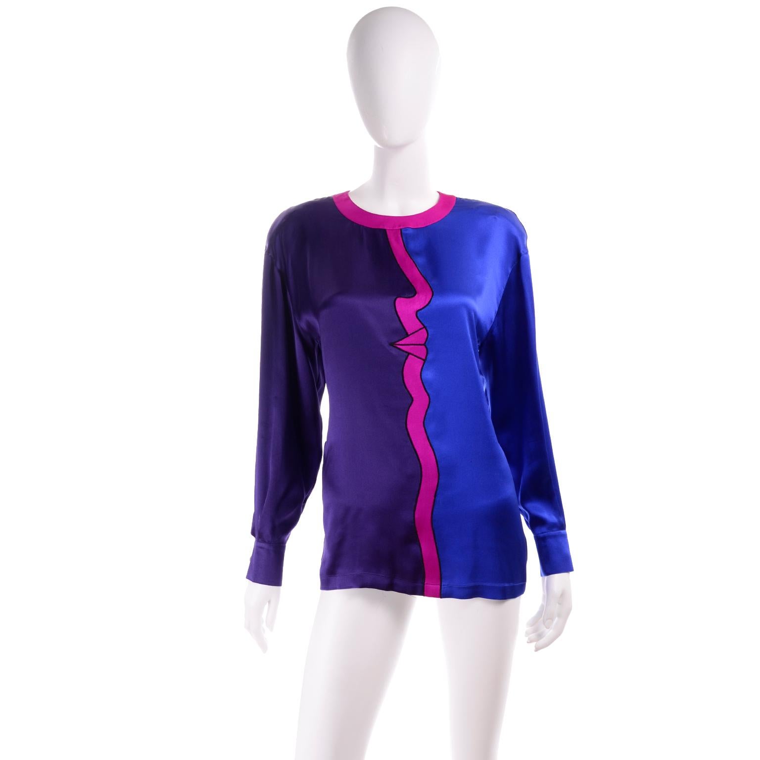 This is a fabulous vintage Escada blouse designed by Margaretha Ley for Escada in the 1980's. The blue, purple and pink silk blouse has an abstract face profile on the front. One arm of the top is purple and the other is blue with the magenta around