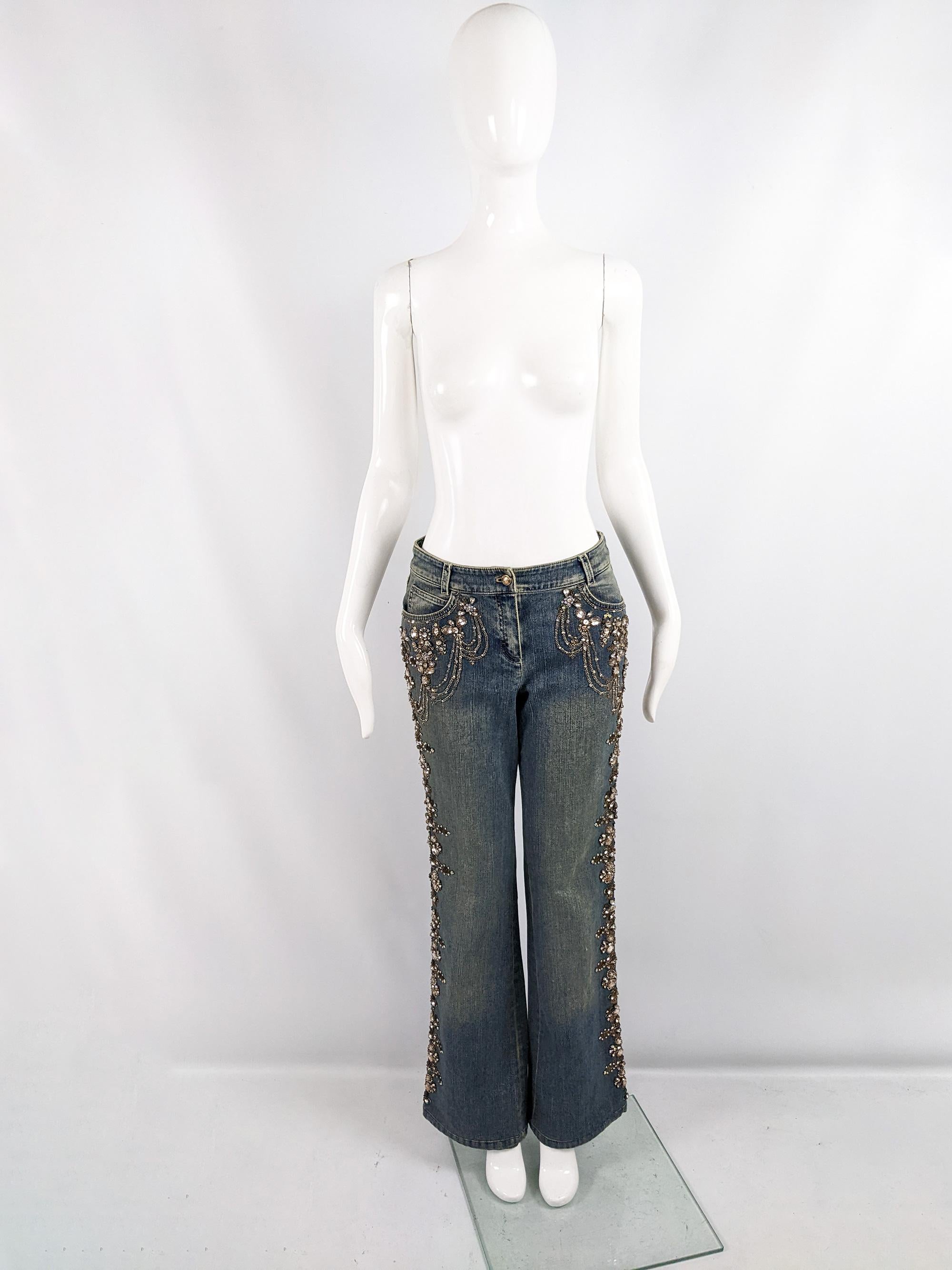 An amazing pair of vintage womens jeans from the late 90s/ early 2000s by luxury fashion house, Escada. Incredible quality, with a heavy weight denim and beautifully intricate beading and sequins down the legs and a black leather patch to the