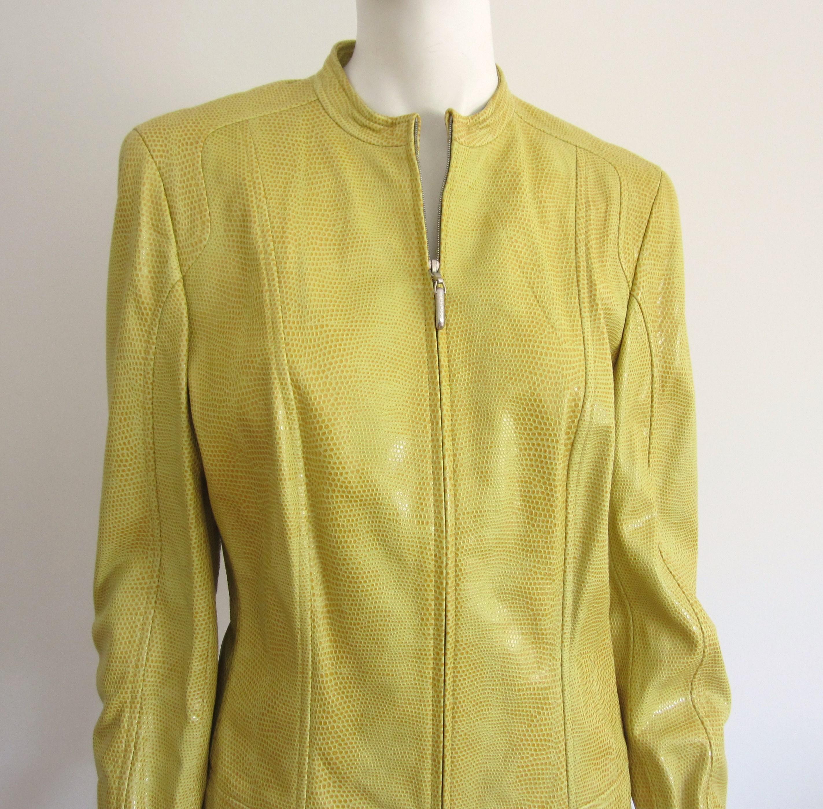 Yellow Reptile Embossed Leather Fitted Jacket New With Tags from the 1990s. Zippered front, with zippered arms. Measuring up to 38 in. waist- Up to 34-inch waist-- 24-inch sleeve -- 22.5 inches long. Labeled a 38. WIll fit an 8-10. Please refer to