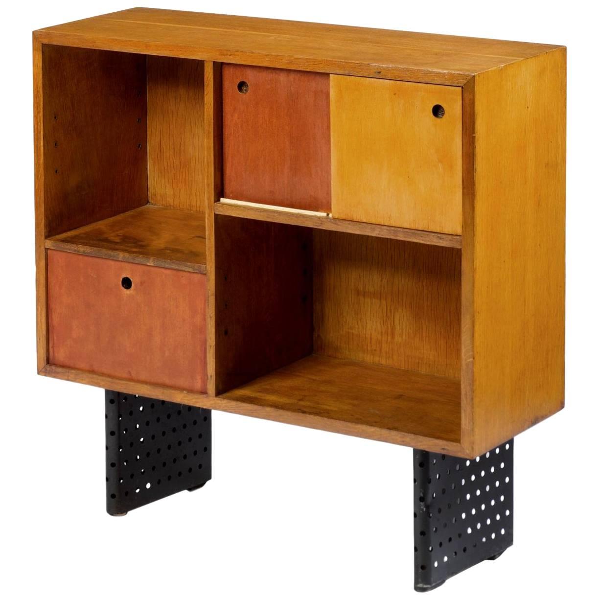 Super rare Escande cabinet. Designed for University D' Antony. Escande was a student of Prouve. This design bears a striking resemblance to some of Prouve's best pieces. Hardly ever available for sale. Oak frame with sliding doors, two inset cubby
