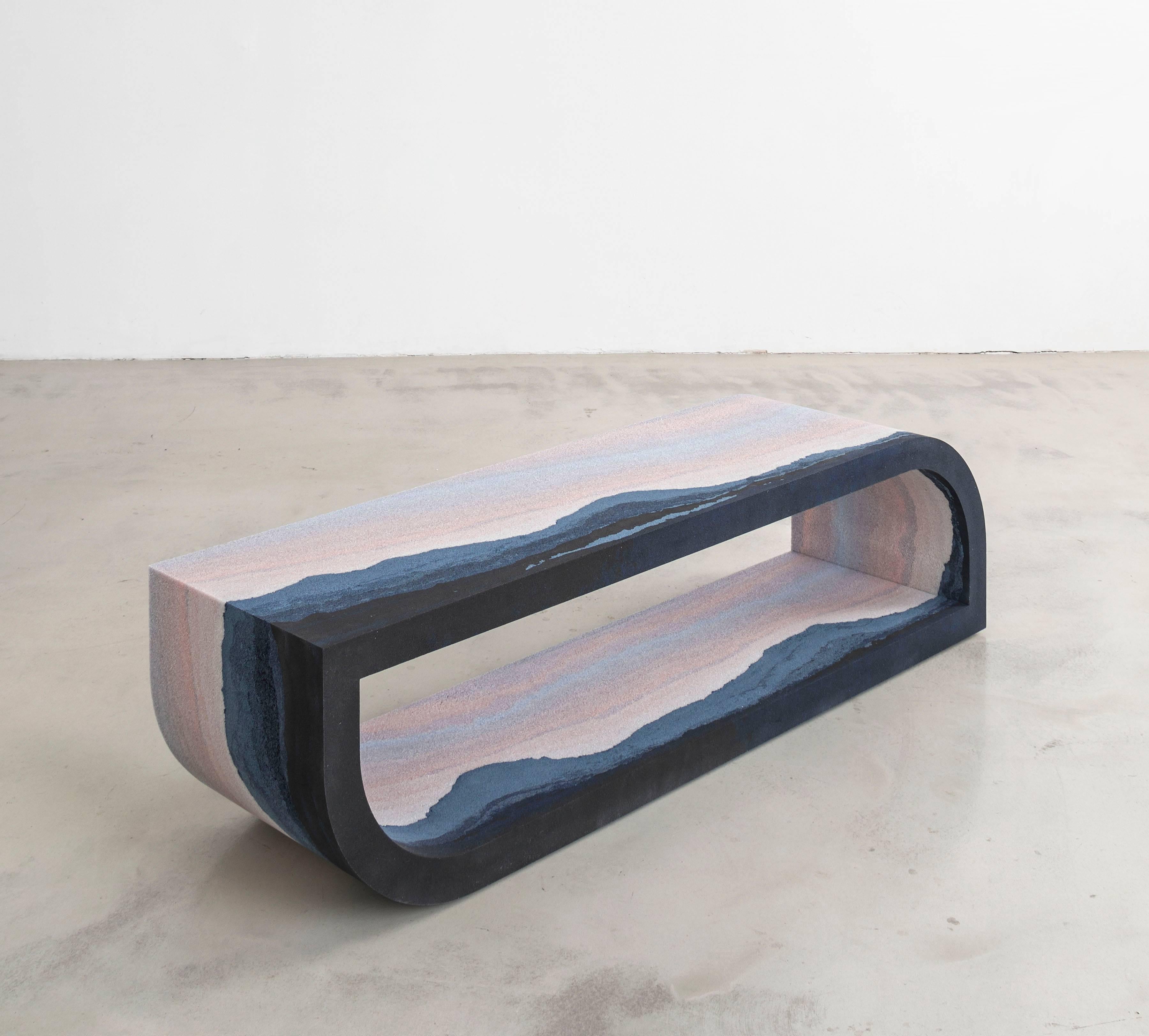 The Escape bench is furniture as escapism. Each piece is like a three-dimensional landscape painting - the simple, geometric forms are seamless gradients of tones and textures. The materials impart an ethereal quality. Silica, with its lava-like