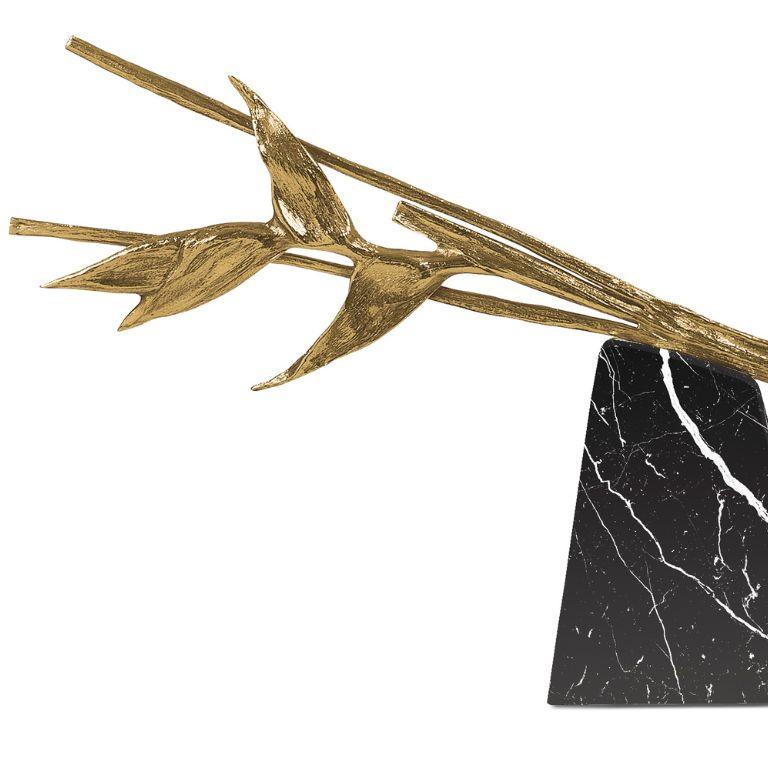 Escape is both a sculpture and a centerpiece, crafted in Nero Marquina marble and composed of two distinct elements that come together in visual harmony. The deep black surface, crossed by natural white veining, adds intensity and contrast to the