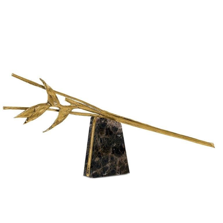 The Escape Sculpture is a captivating expression of movement and stillness, capturing the suspended moment when a Heliconia bloom appears to defy gravity, rising delicately above its marble anchor like a thought ascending toward infinity. Crafted