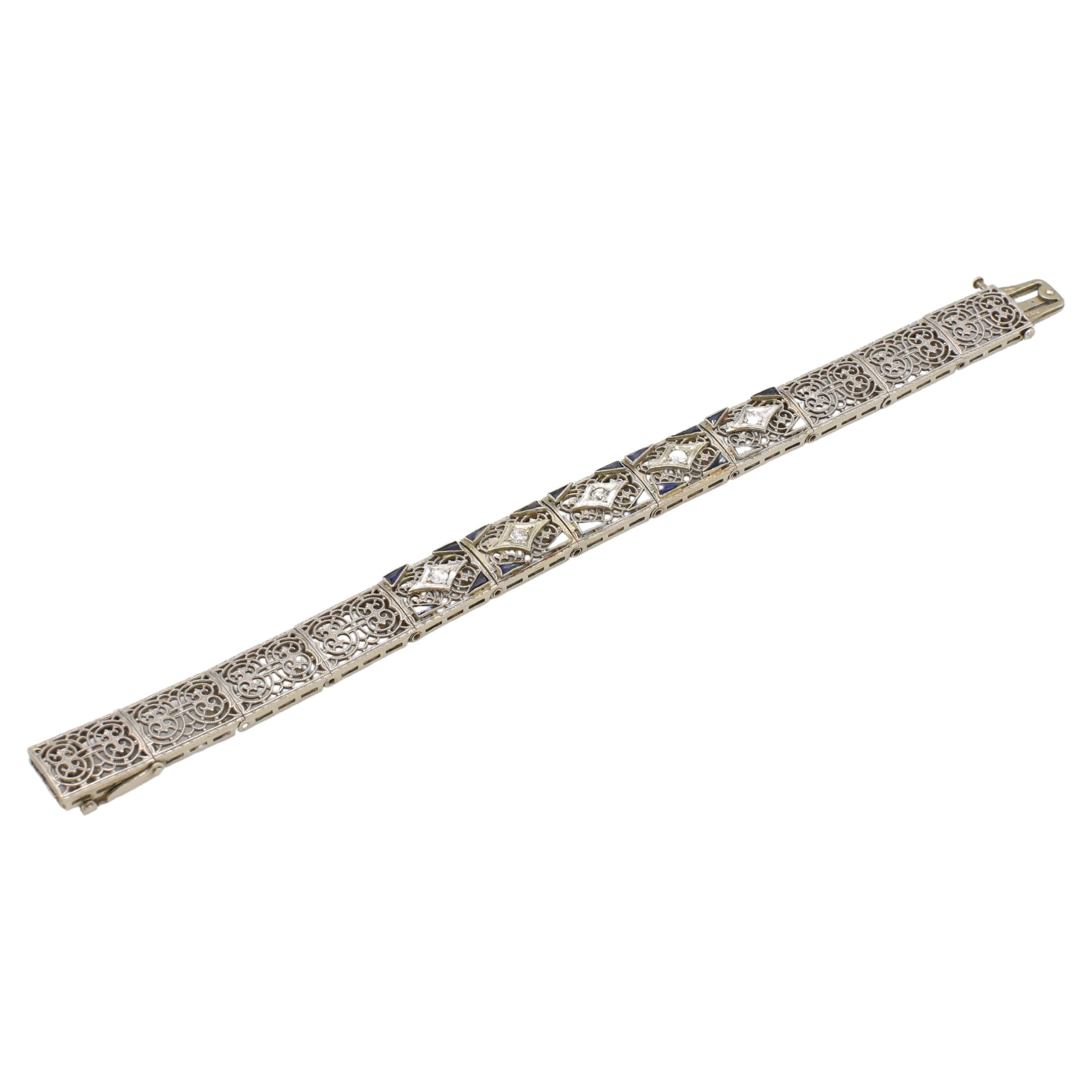 Esemco Art Deco 14 Karat White Gold Natural Diamond & Sapphire Filigree Bracelet 
Metal: 14k white gold & platinum 
Weight: 18.6 grams
Length: 6.5 inches
Width: 10.5mm
Diamonds: Approx. 0.50 CTW round H-I VS natural diamonds
Sapphire: Period