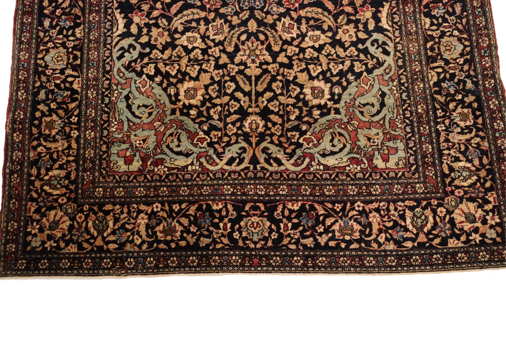 An Isfahan rug is a true masterpiece of Persian weaving, and your rug is no exception. Its breathtaking design is anchored by a radiant sun motif in the center, which is skillfully rendered in vivid shades of red and blue. The sun's warmth and