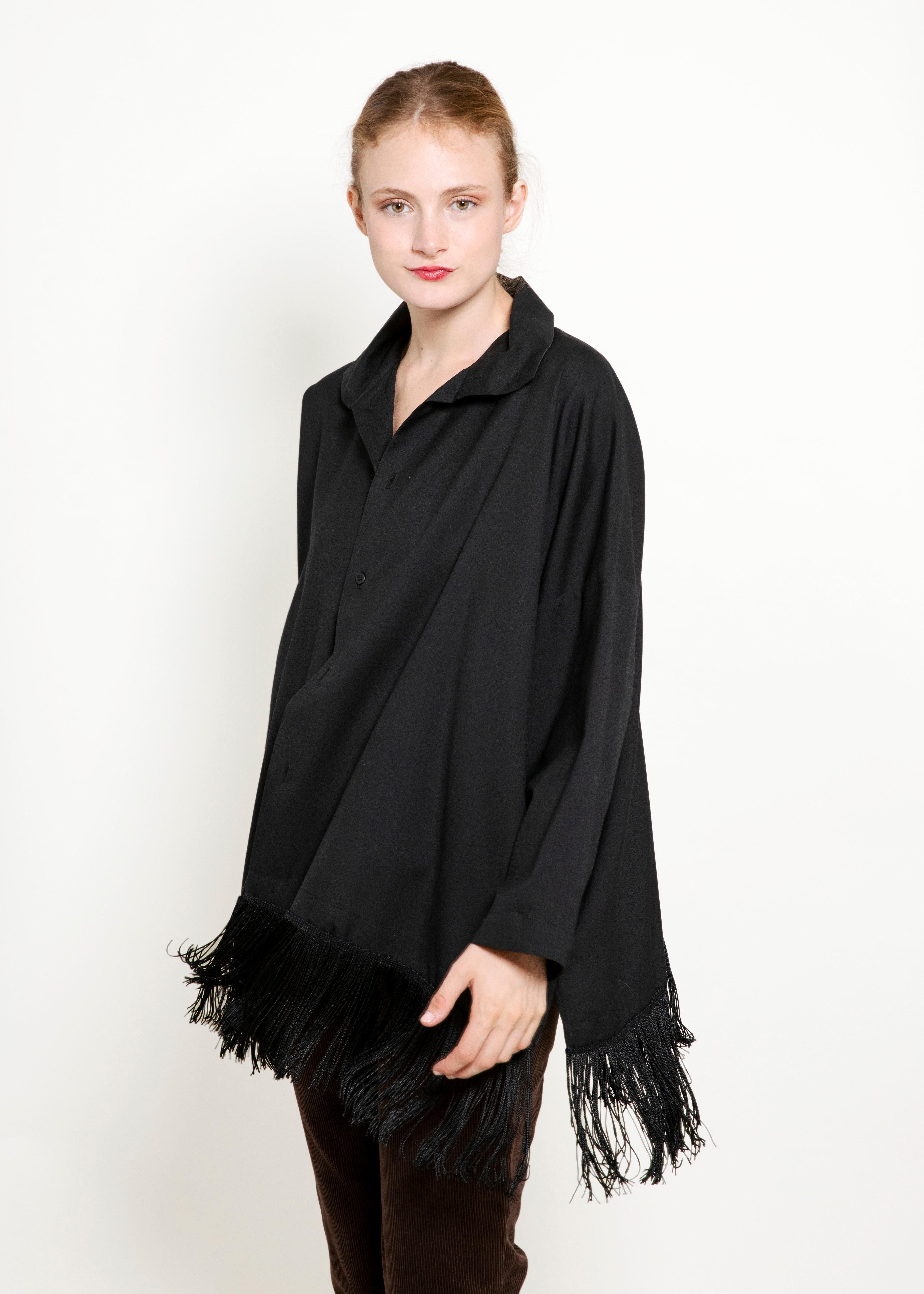 Experience fearless fashion with the eskandar Black Fringe Top. Made with luxurious cashmere, this oversized top features long sleeves and bold fringe details. Take on any challenge with this statement piece.

 

Condition: Excellent Vintage