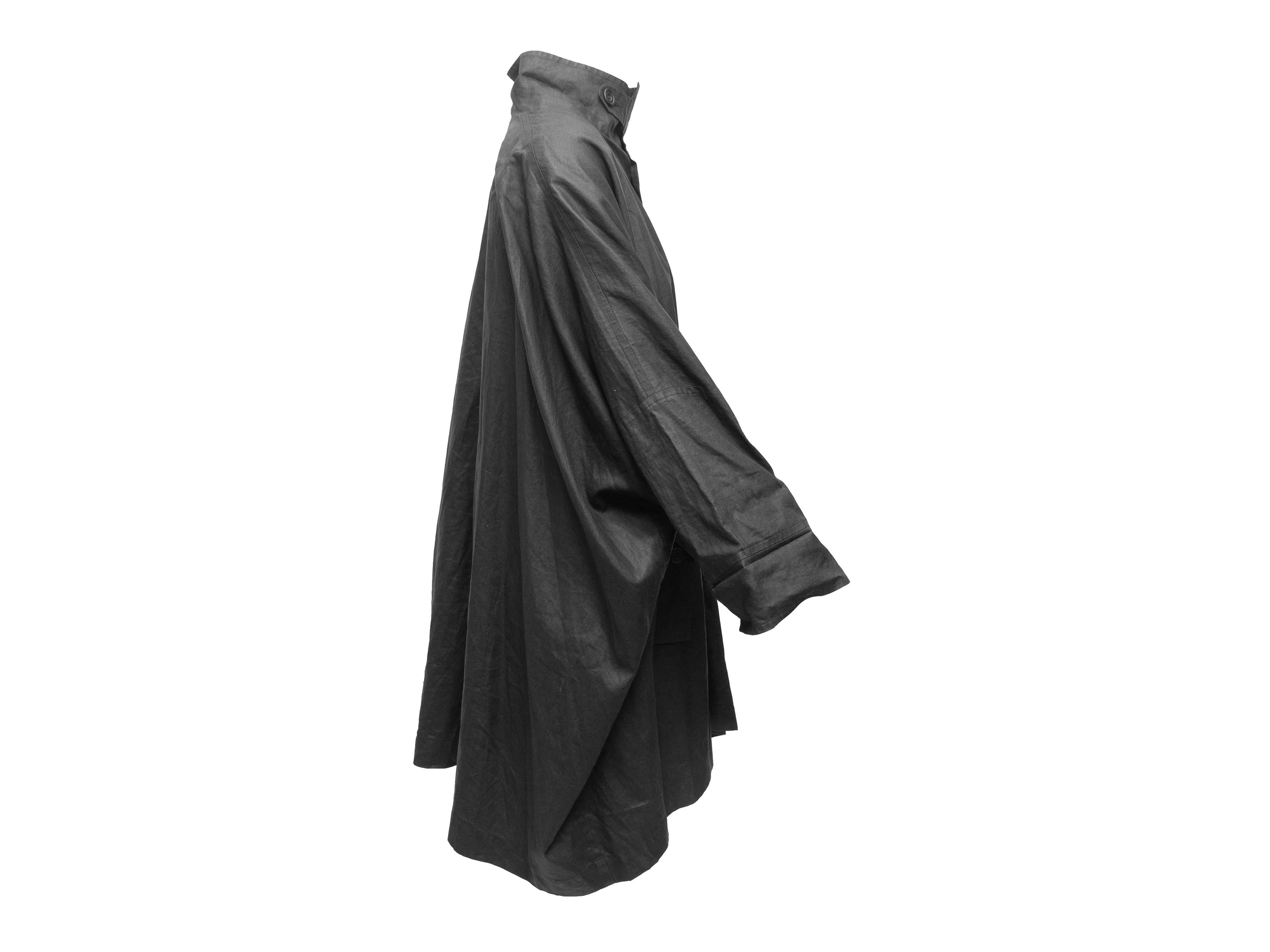 Product details: Black lightweight linen-blend coat by Eskandar. Stand collar. Dual hip pockets. Button closures at center front. 39