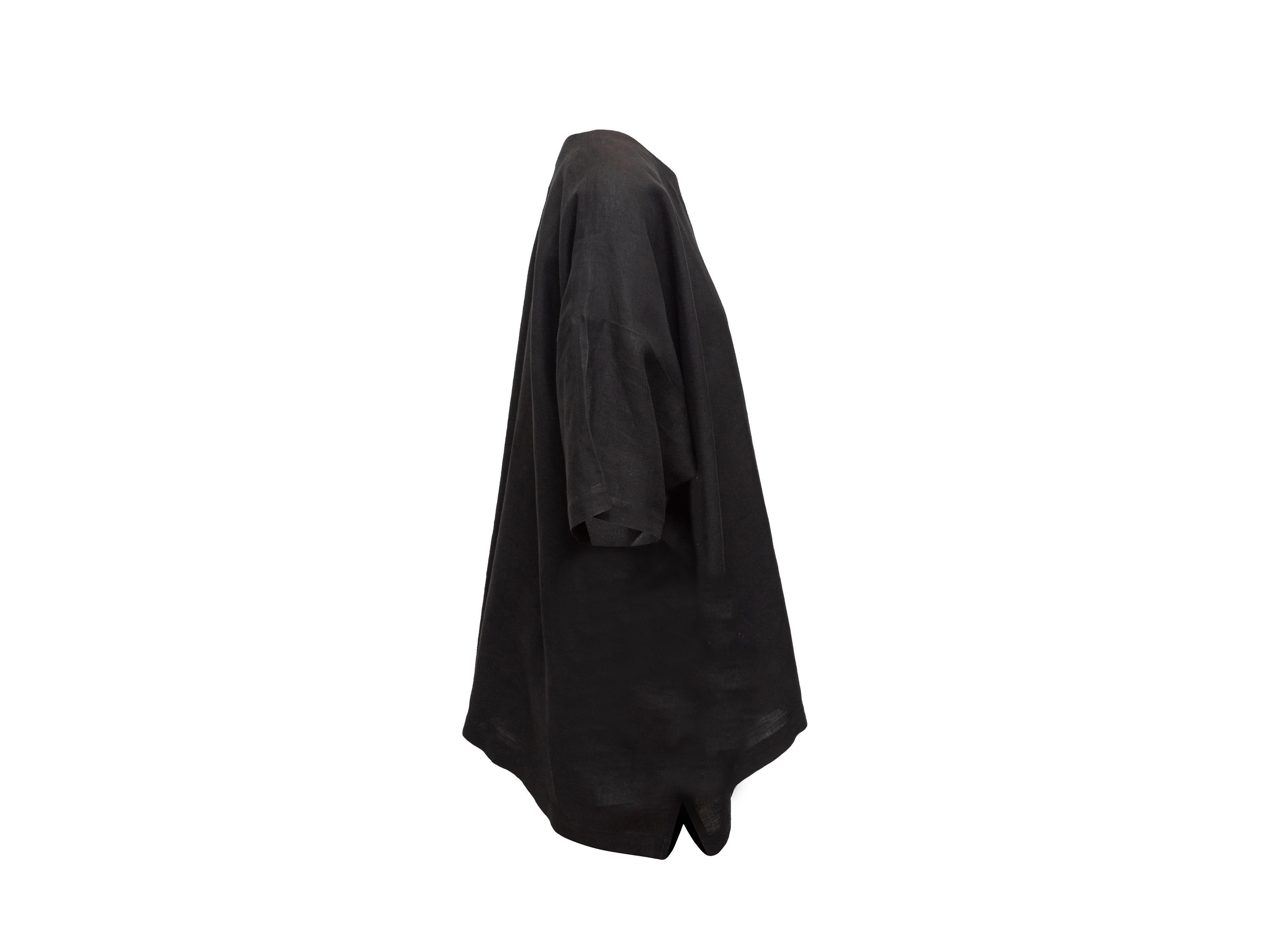 Product details: Black linen oversized top by Eskandar. Crew neck. Short sleeves. Button closures at shoulder. 64