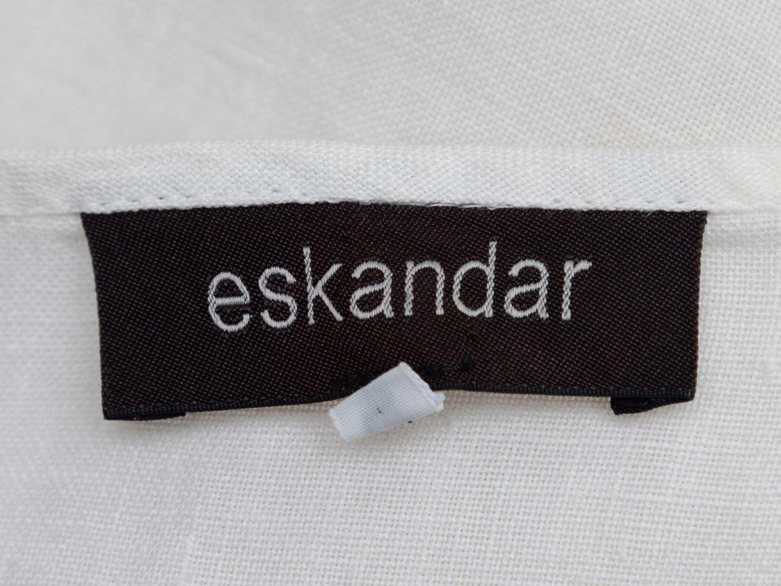 Product Details: White linen oversized button-up top by Eskandar. Crew neck. Long sleeves. Button closures at center front. 56