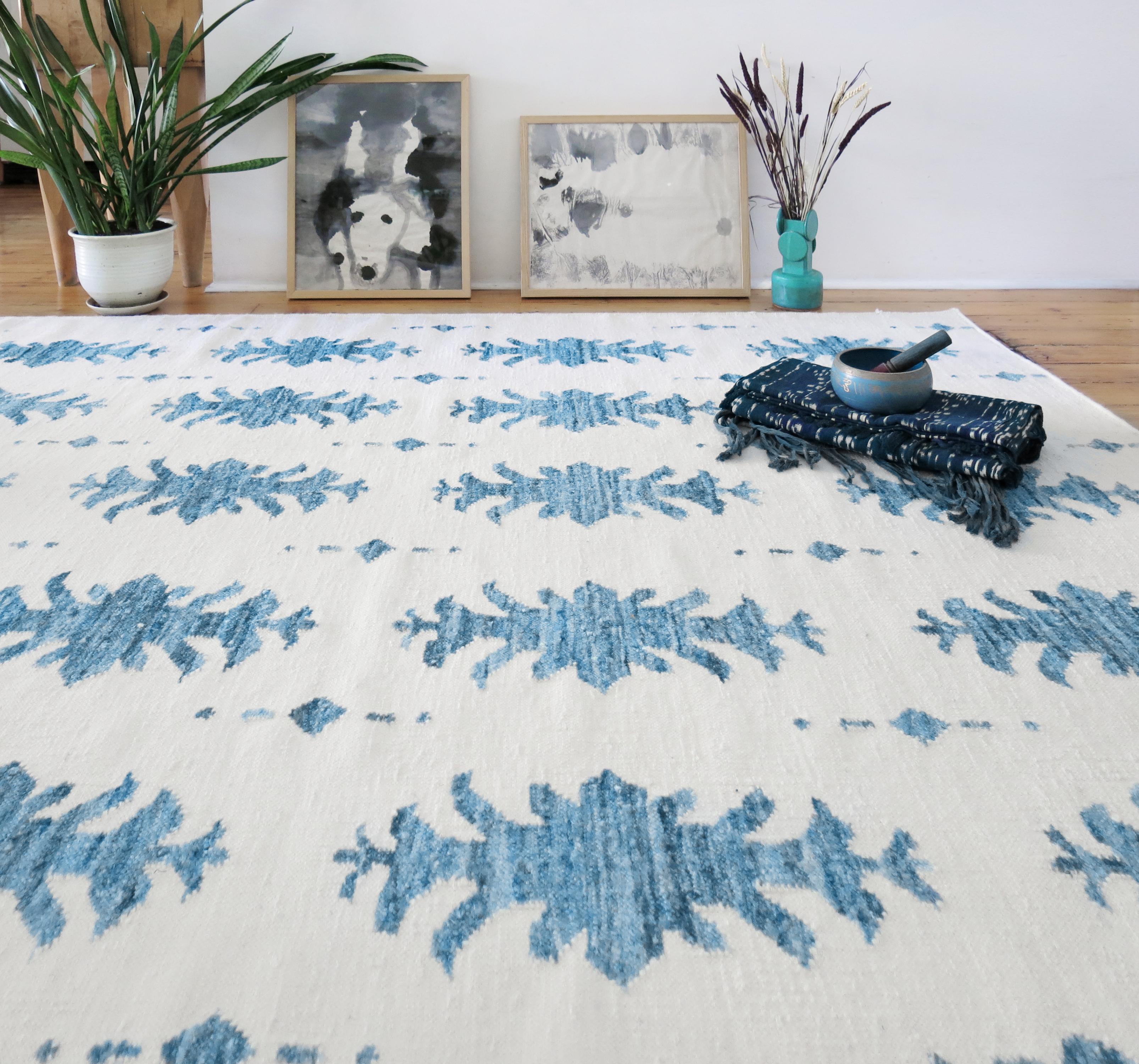 Rug Pattern: Areca Palms - Indigo
Material: Bamboo Silk Design/New Zealand Wool Background
Quality: Flat-weave, handwoven 
Size: 6'-0