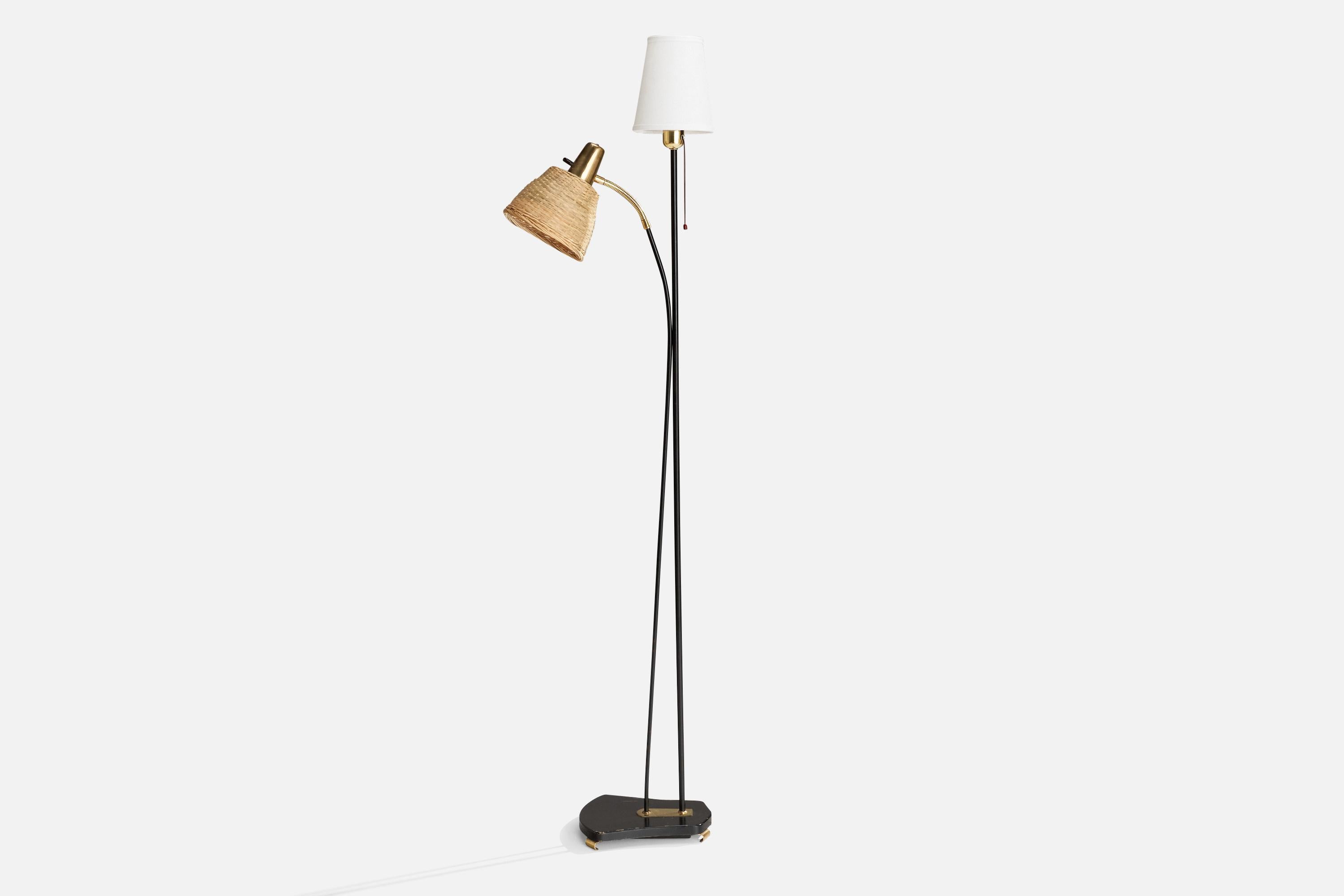 A brass, rattan, fabric and black metal floor lamp produced by Eskilstuna Elektrofabrik, 1950s.

Dimensions variable 
Overall Dimensions (inches): 62” H x 9” W x 16” D
Stated dimensions include shade.
Bulb Specifications: E-26 Bulb
Number of