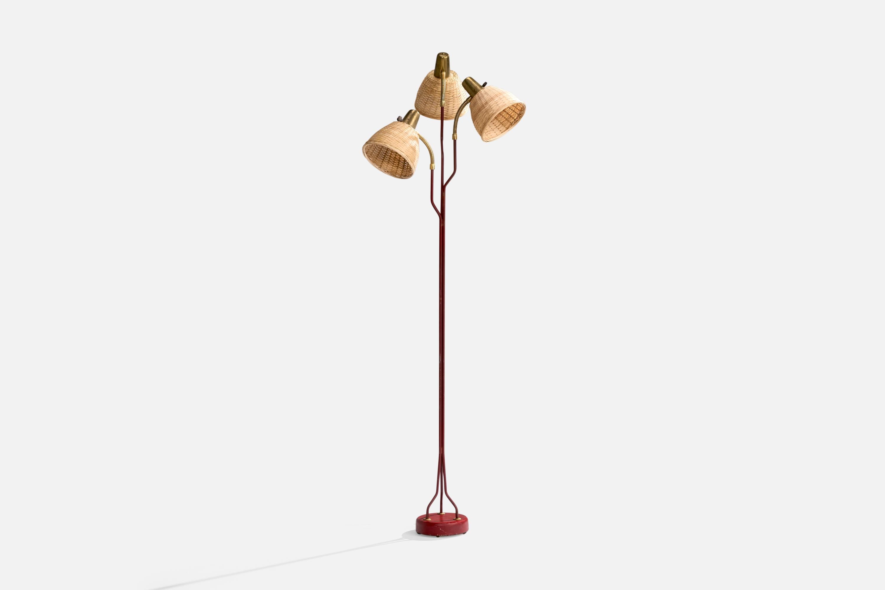 An adjustable three-armed brass, red-lacquered metal and rattan floor lamp designed and produced by Eskilstuna Elektrofabrik Aktiebolag, Sweden, c. 1960s.

Dimensions of Lamp with Shade (inches): 62.1“ H x 17“ W x 13“ D

Bulb Specifications: E-26