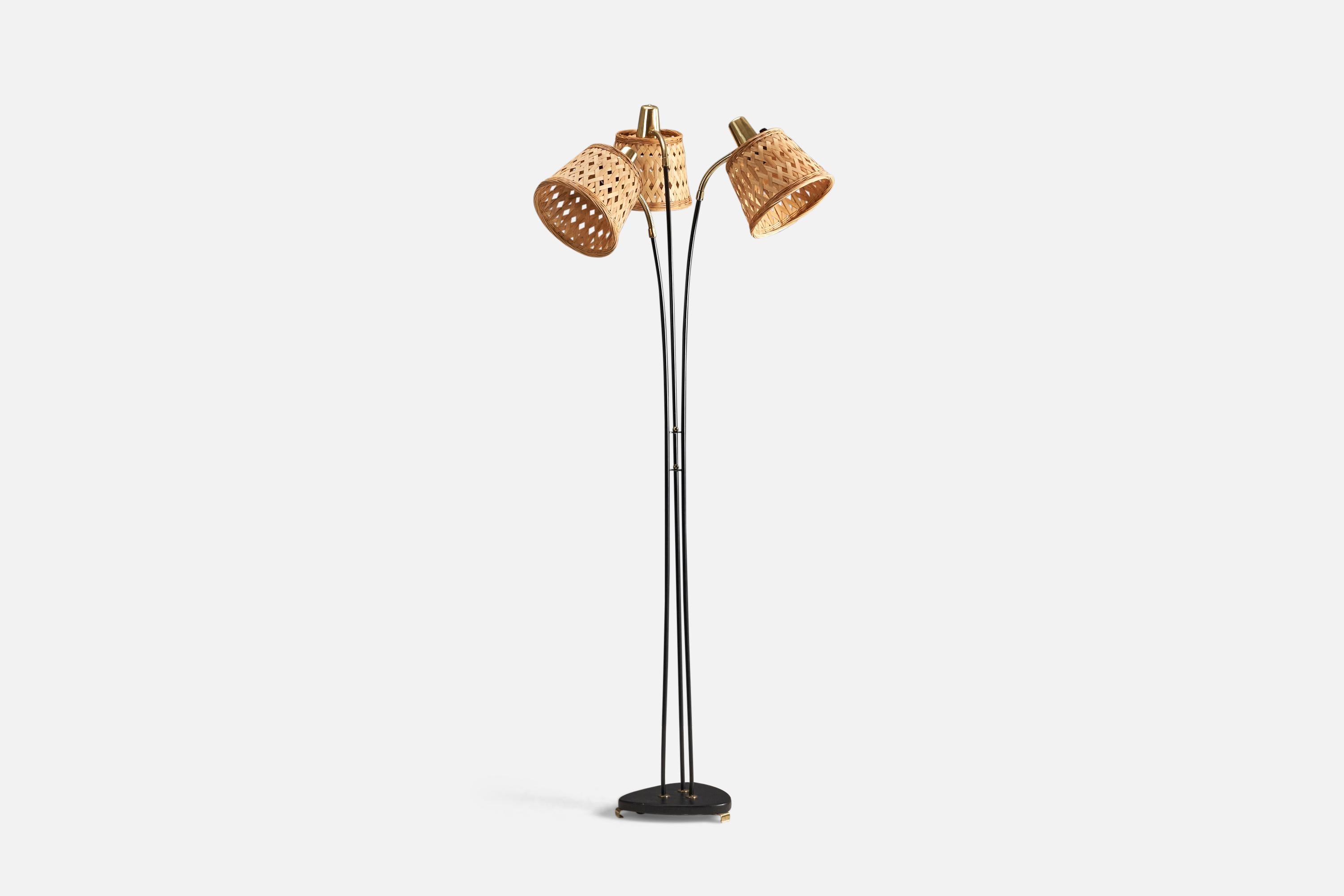 A metal, brass and rattan floor lamp designed and produced by Eskilstuna Elektrofabrik, Sweden, 1950s.

Sockets take standard E-26 medium base bulbs.

There is no maximum wattage stated on the fixture.