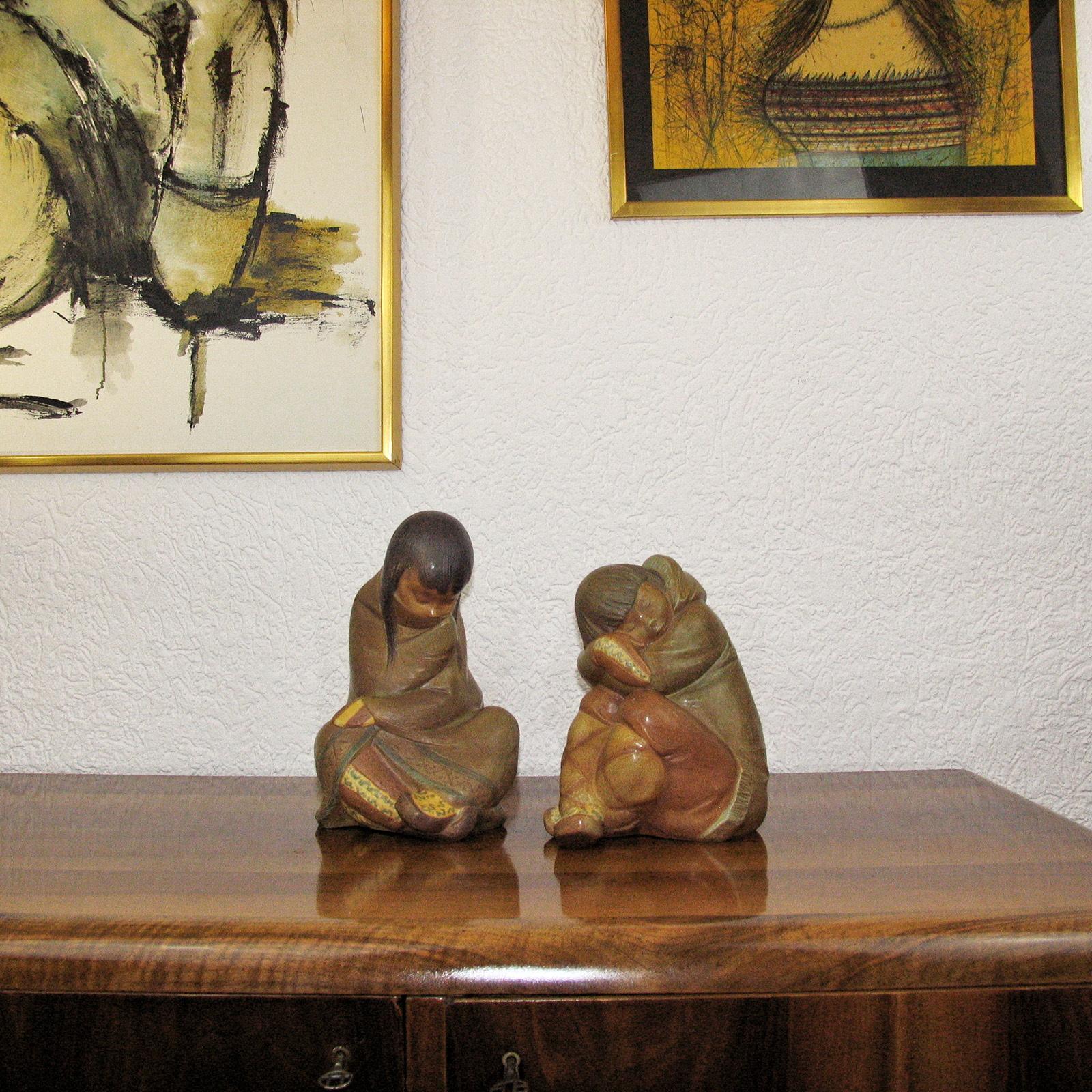Lladro Gres Eskimo Boy and Girl, Spain, 1970s.
Lladro gres ''Eskimo Boy'' and ''Eskimo Girl'' figurines.
Design by Juan Herta, issued in 1970, retired in 1990. 
Lovely collectible pieces!

Dimensions:
Taller figure: 30 x 19 cm (11.81 x 7.48