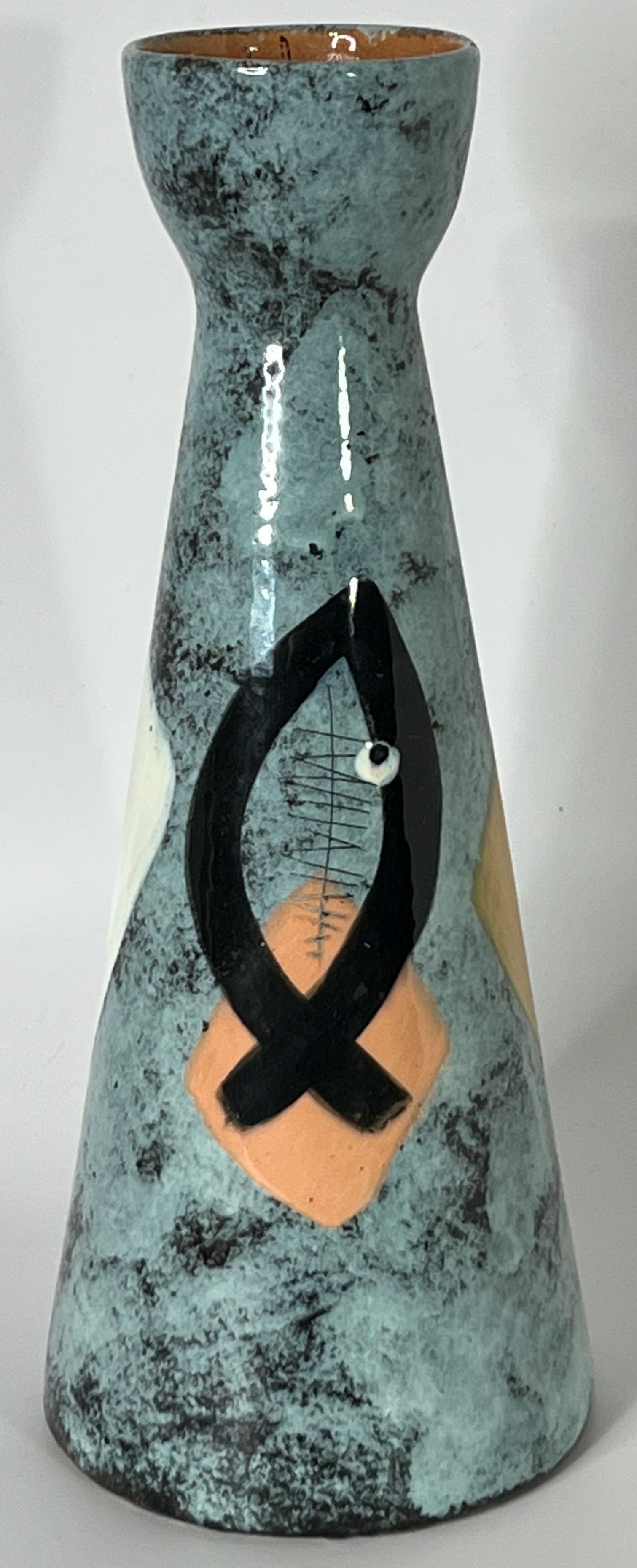 A rare large scale Eskimo fisherman theme mid century modern vase by noted California Artist Edmund Ronaky. Signed to the base and a quintessential West Coast work of modernism. The combination of painted slip and scratch carving draw detail and
