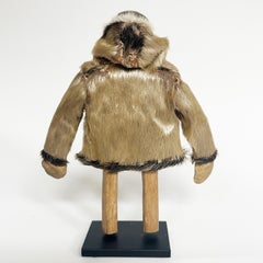 Eskimo Wood Carving of a Man with Seal Coat, North Coast, 20th Century