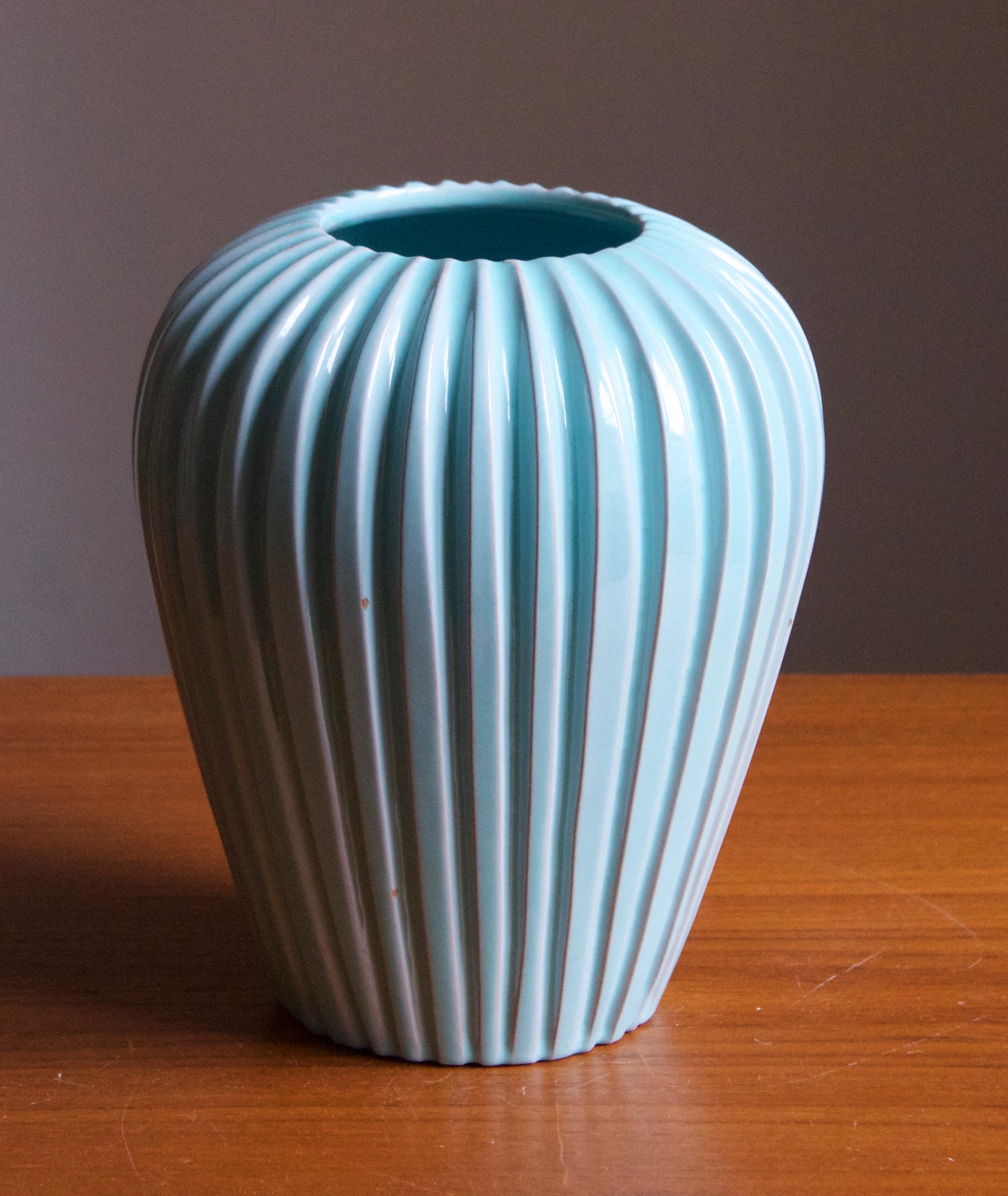 A fluted vase by Eslau Keramik. In blue-glazed stoneware. Designed and produced 1950s.