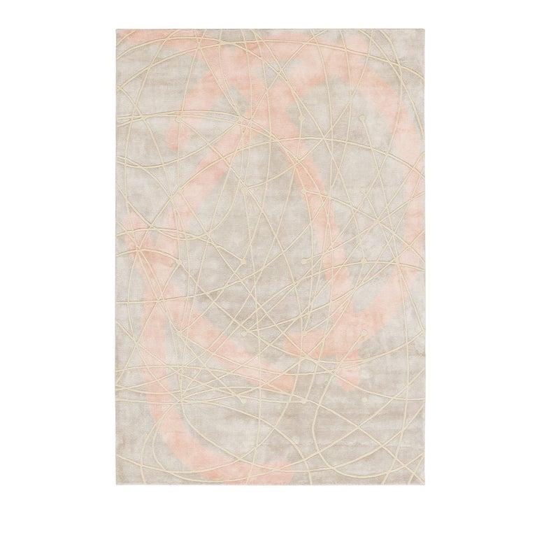 Hand knotted using silk and wool over a cotton base, this exquisite rug was designed by Martina Merlini of Casalinghe di Tokyo. Inspired by the idea of movement that evokes the Italian migrations of the beginning of the 20th century and the more