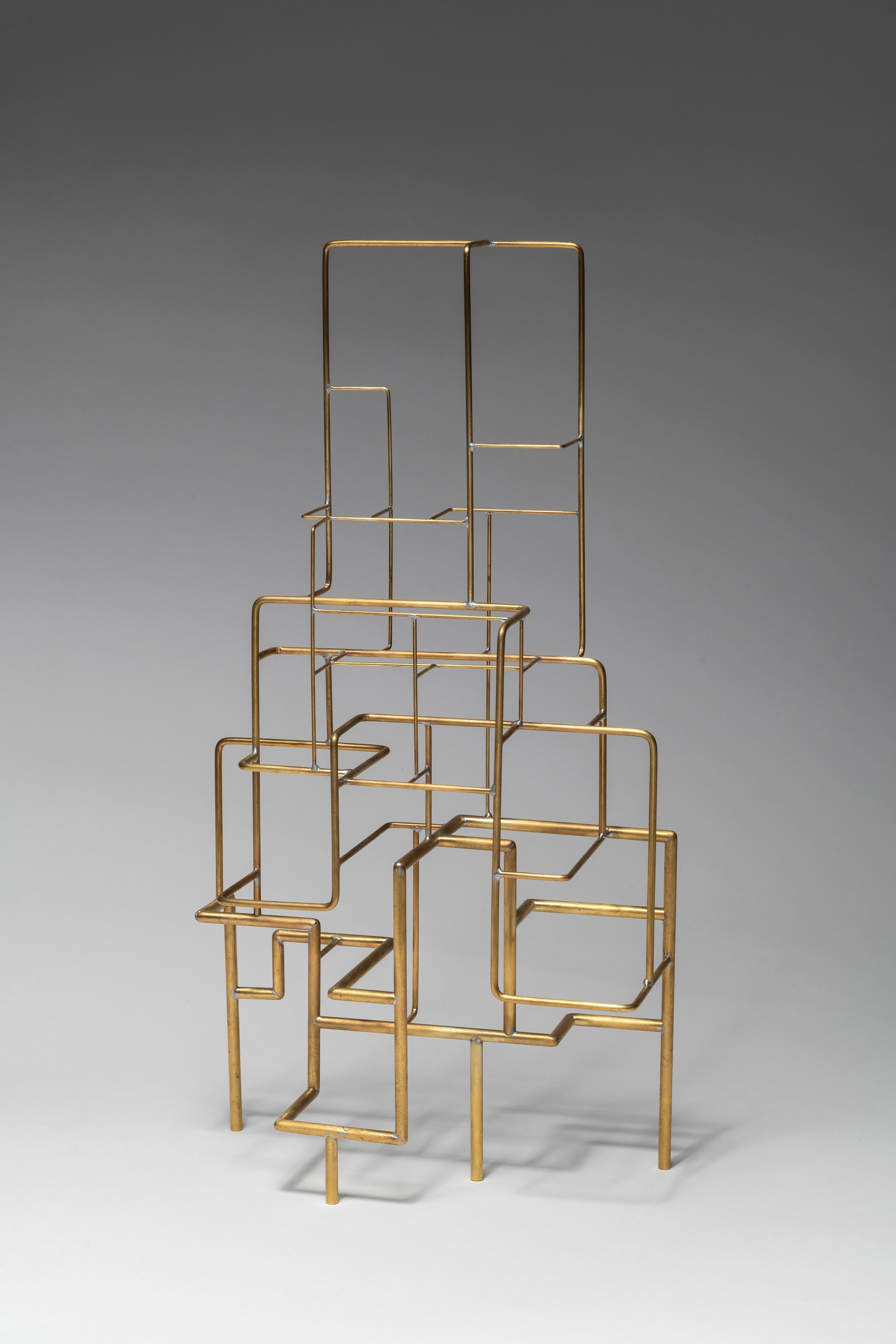 Espalier was created in 2022 by French designer Eric de Dormael. Hancrafted in brass, this is a unique piece.
Éric de Dormael is an unconventional artist, his trajectory far from the beaten track. Trained at the Saint-Luc school in Tournai and at
