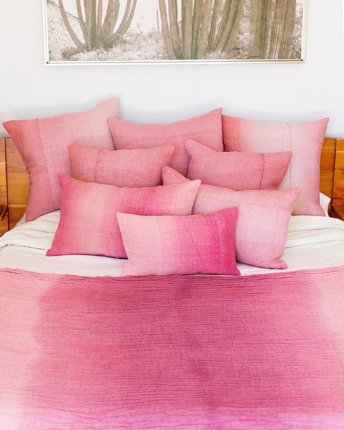 These handmade pink ombre cushions are the perfect pop of color to brighten up your space. Hand made from natural materials like vintage linen, they are sure to make your living room or bedroom feel more modern while adding a rustic charm. With