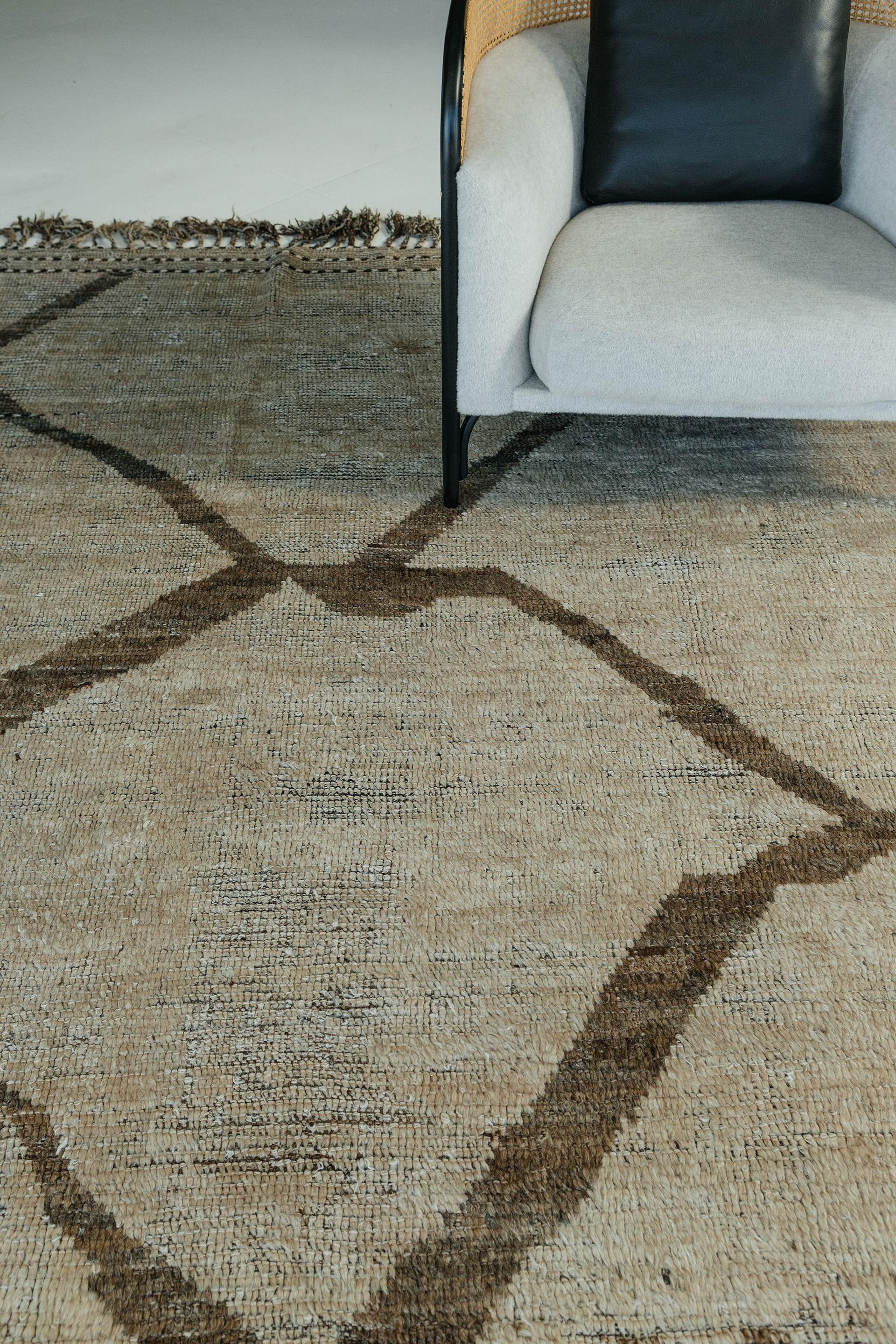 Esparto is a natural earth toned rug and a modern interpretation of the Moroccan world. This rug's irregular brown strokes resemble the fibers of nature and their ability to be used for crafts such as cords and basketry. Designed in Los Angeles for