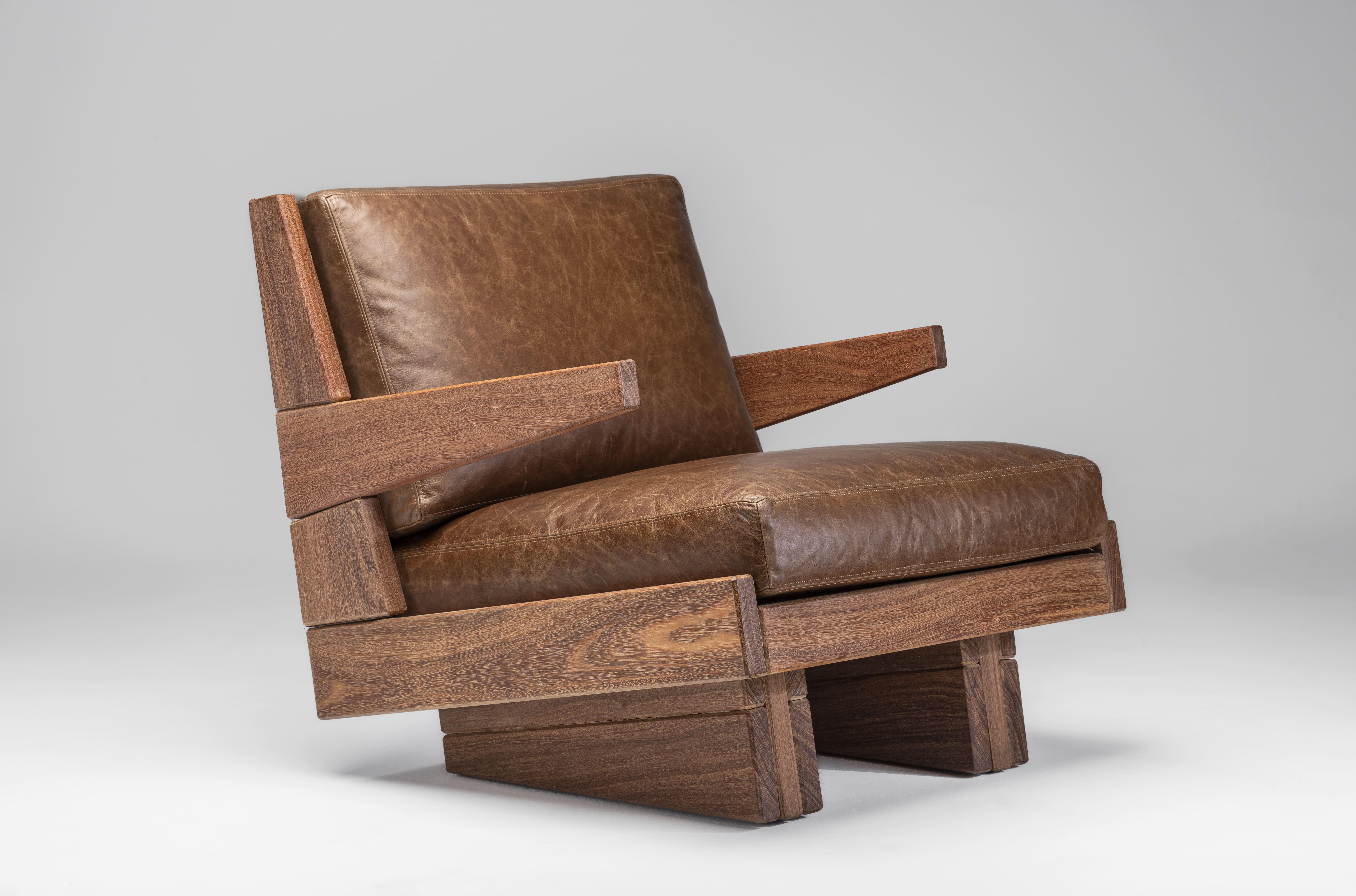The Espécie Armchair by Zanini de Zanine is crafted from solid Cumaru wood, seamlessly blending modern design with traditional craftsmanship. 
This chair comes in two versions: one with armrests for added comfort and another without, offering a more