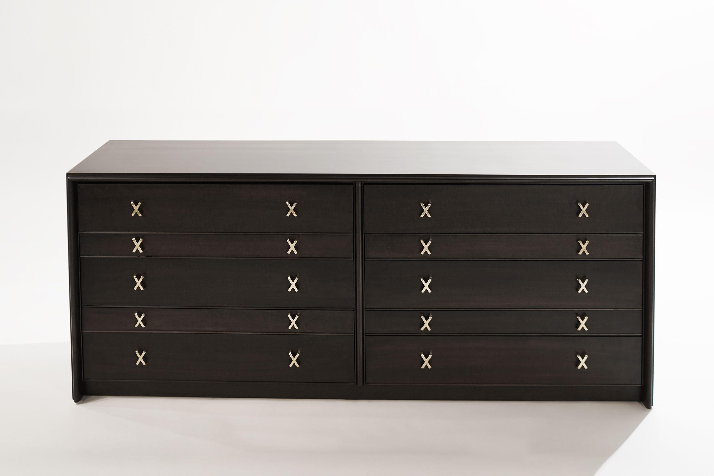 A beautiful double dresser that comprises ten drawers in varying depths, completely restored in an espresso finish, features brass X-Shaped hardware which has been hand-polished. Burned-mark by Johnson Furniture (manufacturer of the case) and a