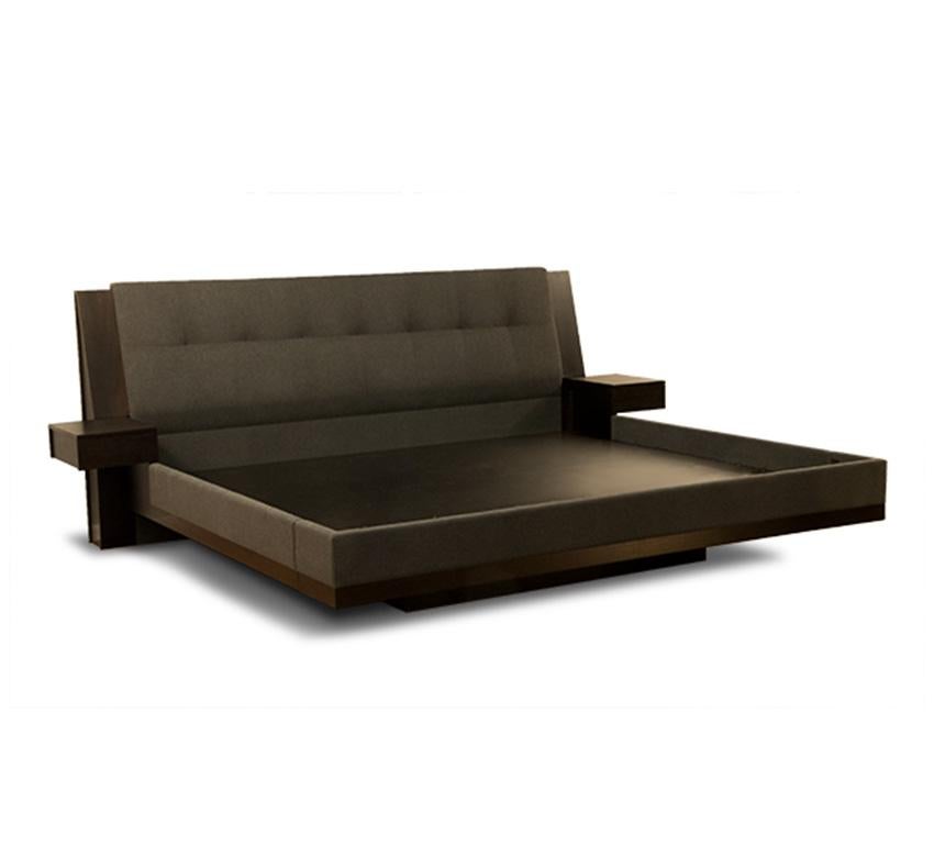 The Floating Platform Bed gives the illusion of a floating bed. Made out of espresso mahogany the side-rails and headboard are upholstered in grey fabric provided by the customer. There are two small 12