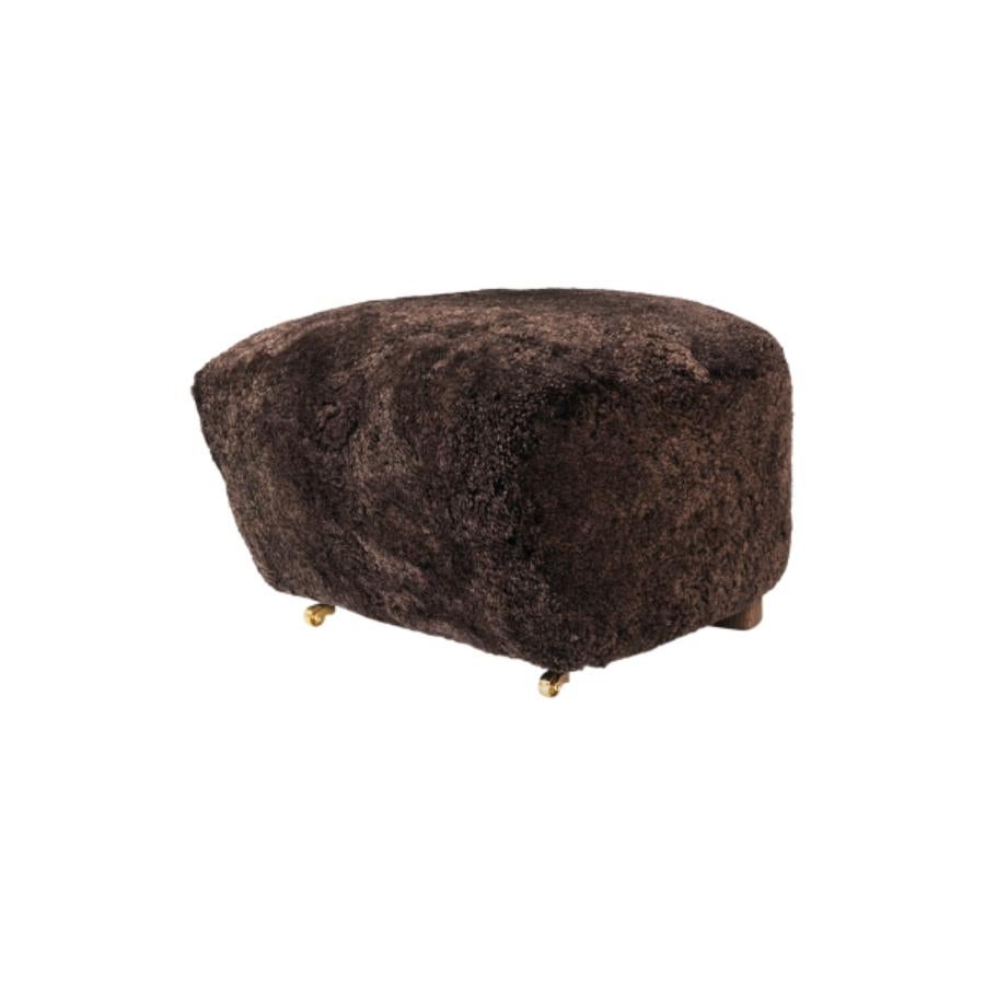 Espresso smoked Oak Sheepskin the Tired Man footstool by Lassen
Dimensions: w 55 x d 53 x h 36 cm 
Materials: Sheepskin

Flemming Lassen designed the overstuffed easy chair, The Tired Man, for The Copenhagen Cabinetmakers’ Guild Competition in
