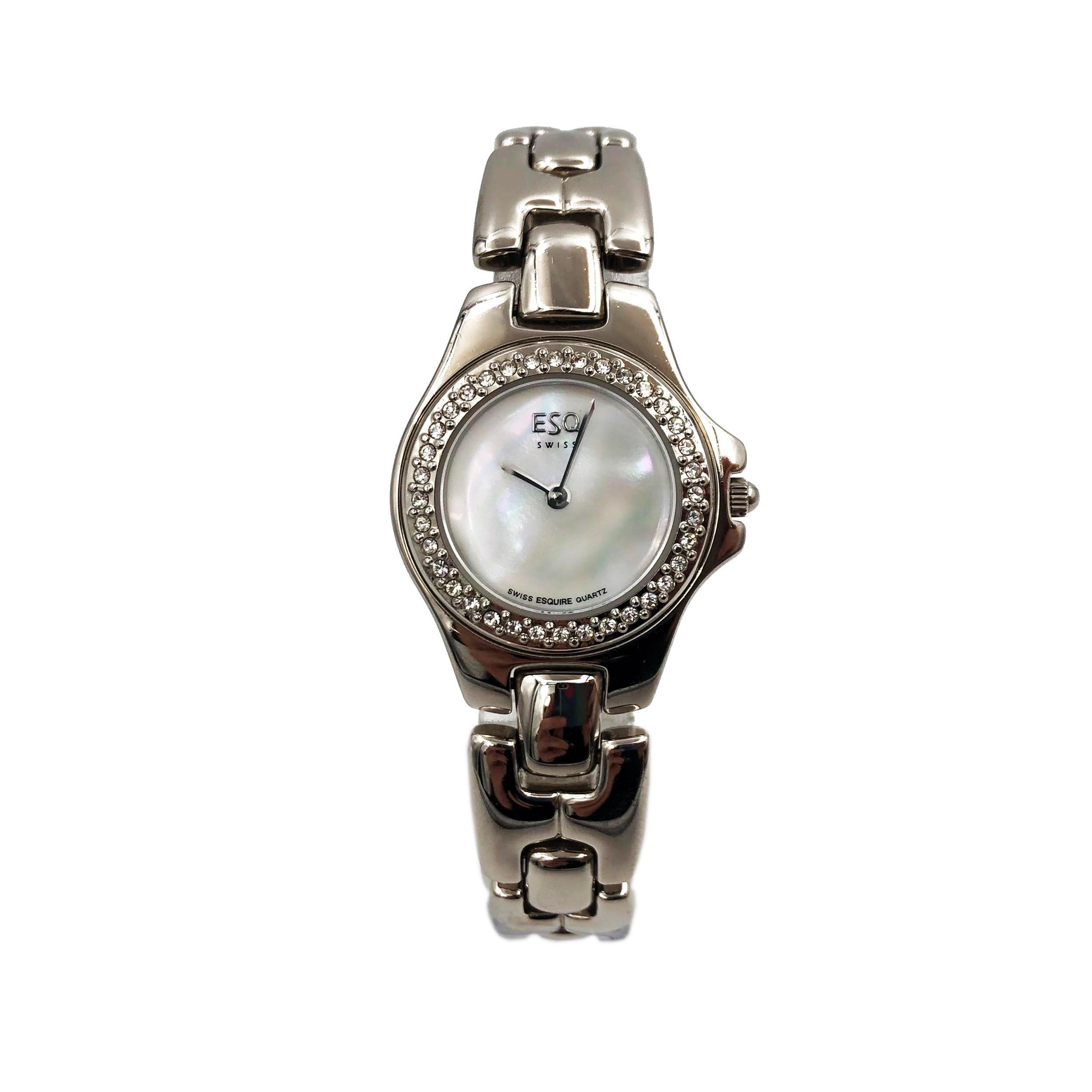 Pre Owned ESQ Movado Stainless Steel White MOP Dial Quartz Ladies Watch 100533A. The Watch Has Minor Scratches. This Beautiful Timepiece is powered by a Quartz (Battery) Movement and Features: a Silver-Tone Case and Bracelet, Fixed Silver-Tone