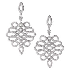 Essence of Flow: 18kt Gold Earrings with Natural White Diamonds